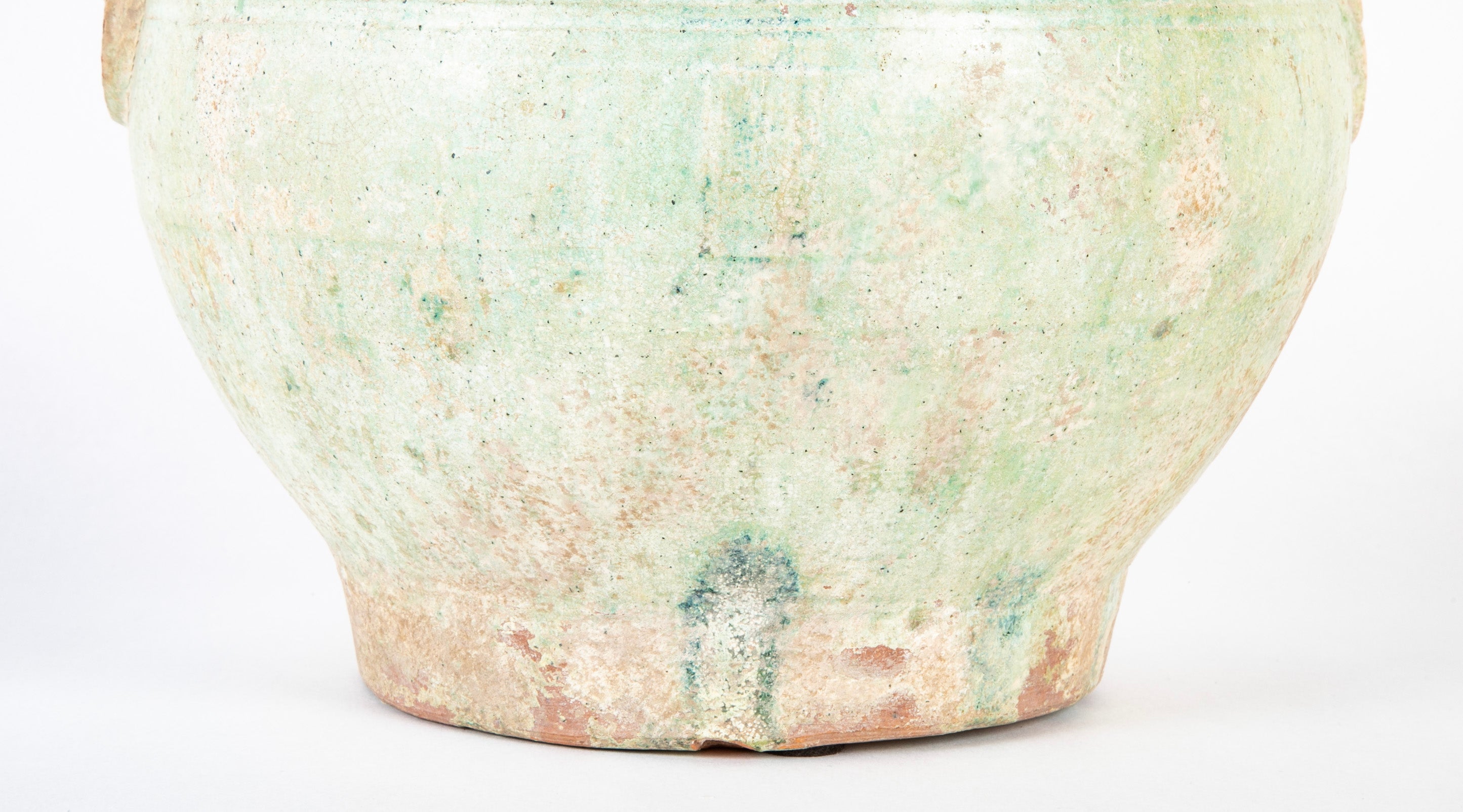 Han Dynasty Pottery Jar with Green Glaze and Molded Masks as Applied Handles