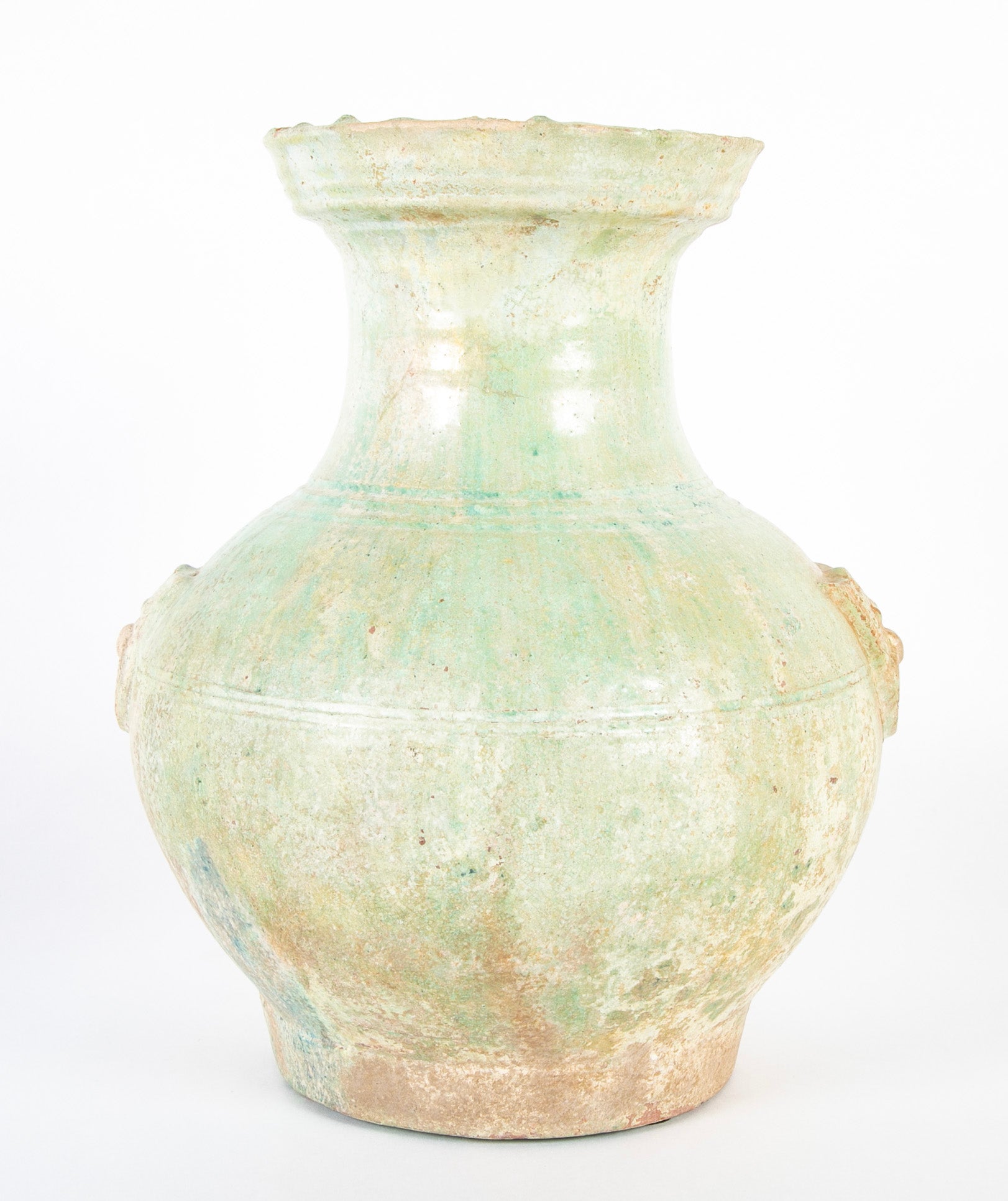 Han Dynasty Pottery Jar with Green Glaze and Molded Masks as Applied Handles