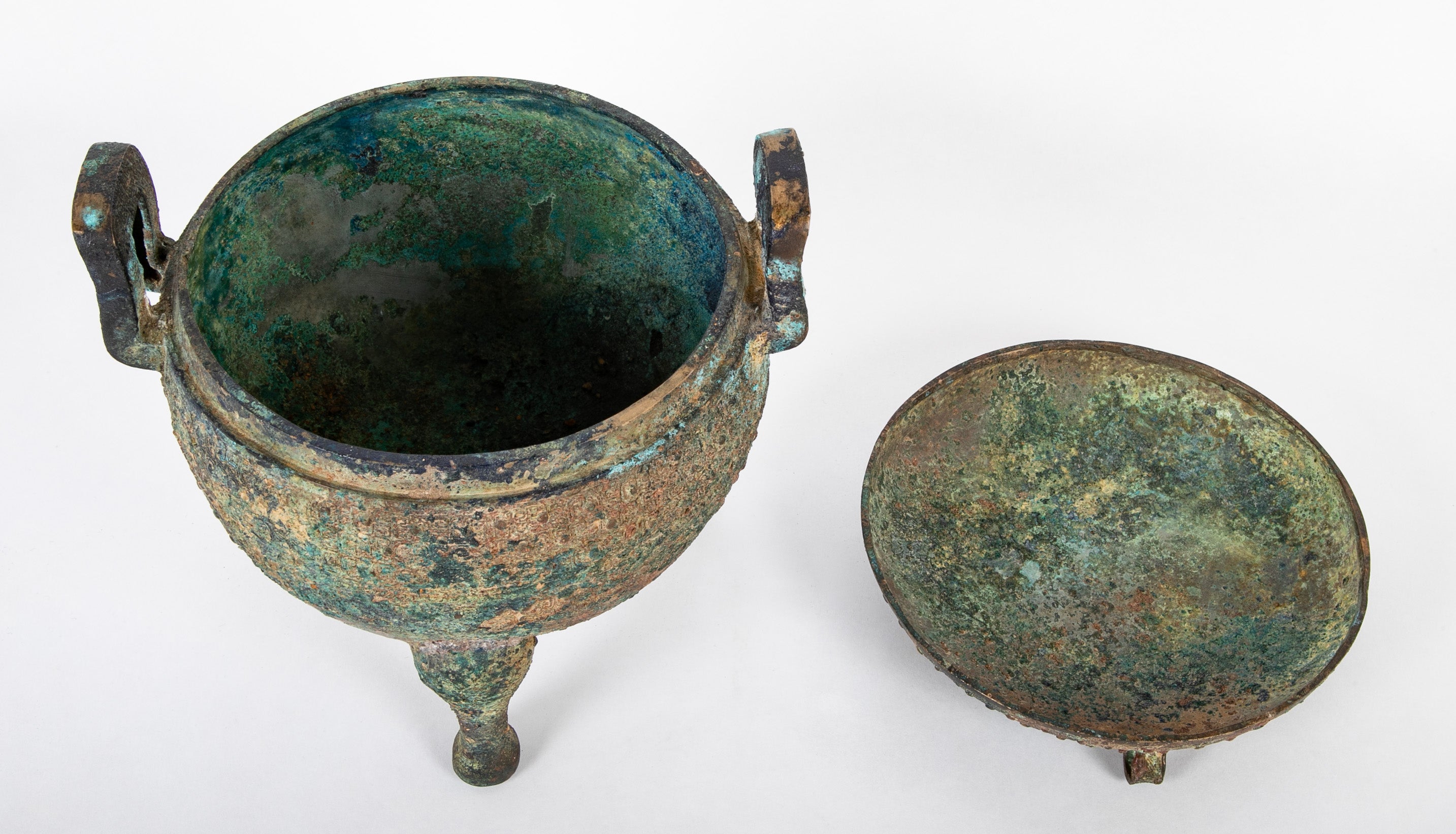 A Chinese Archaic Ding Style Bronze Covered Vessel