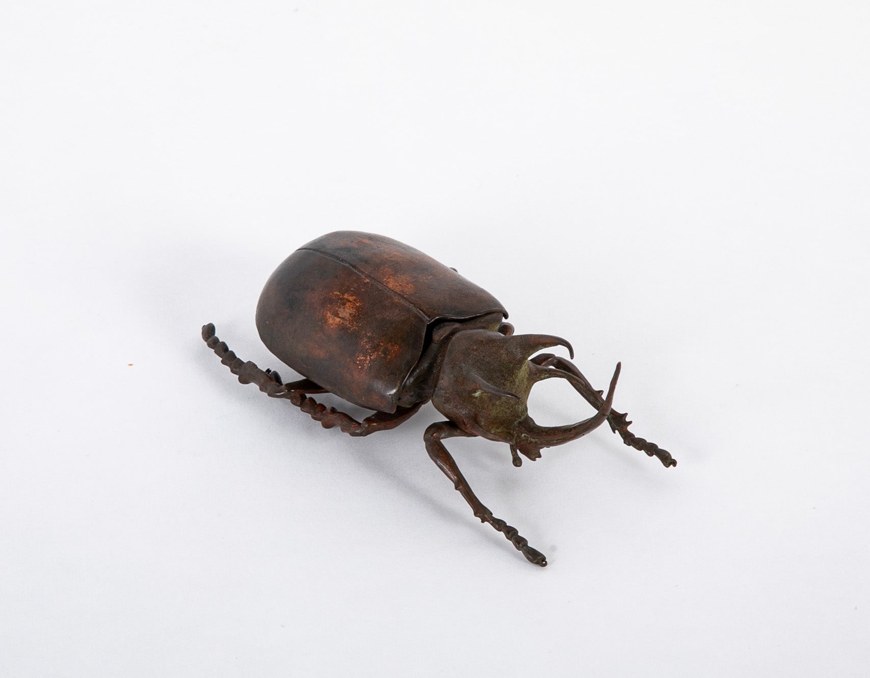 A Japanese Patinated Bronze Rhinoceros Beetle with Opening Back