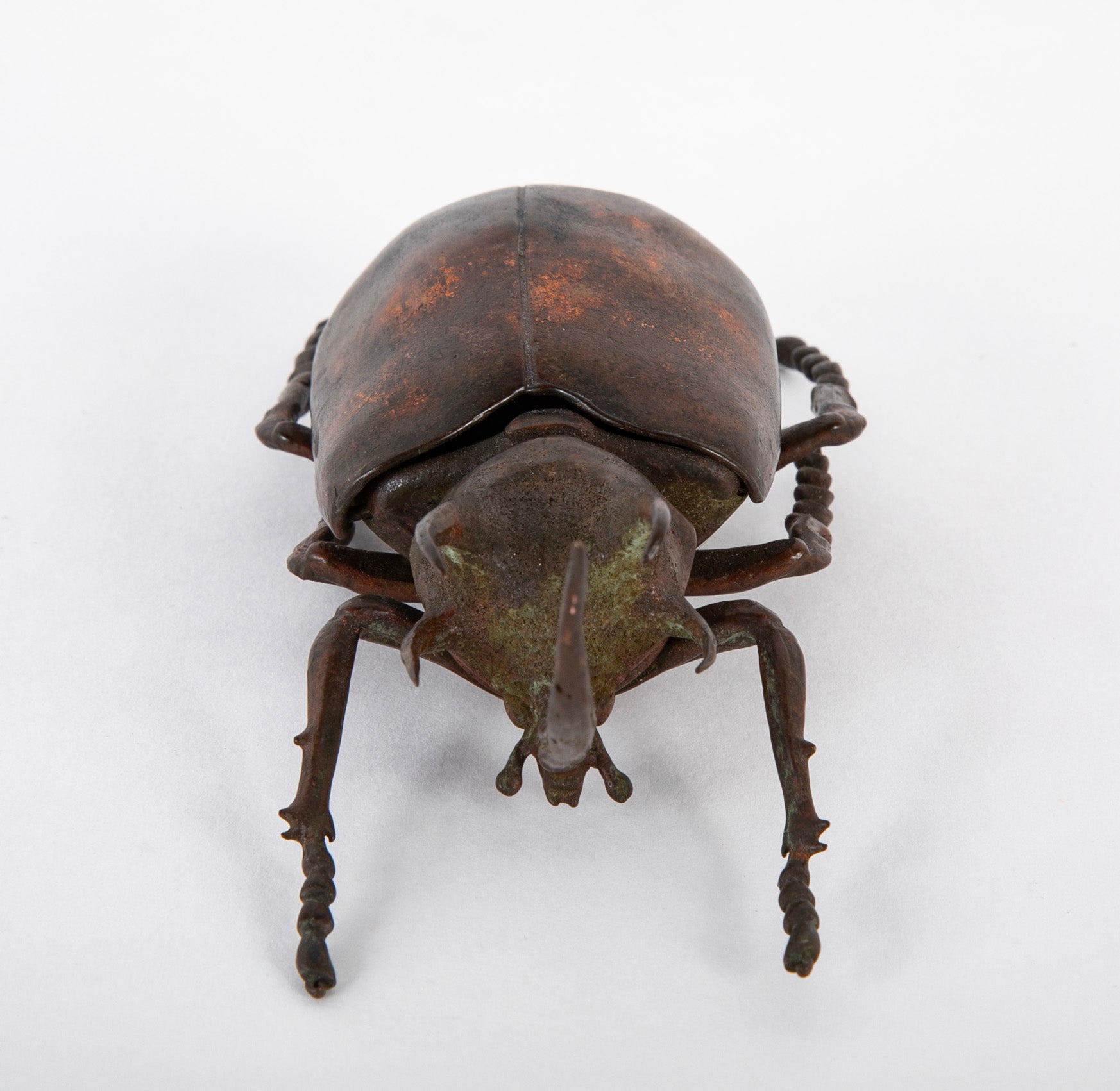 A Japanese Patinated Bronze Rhinoceros Beetle with Opening Back