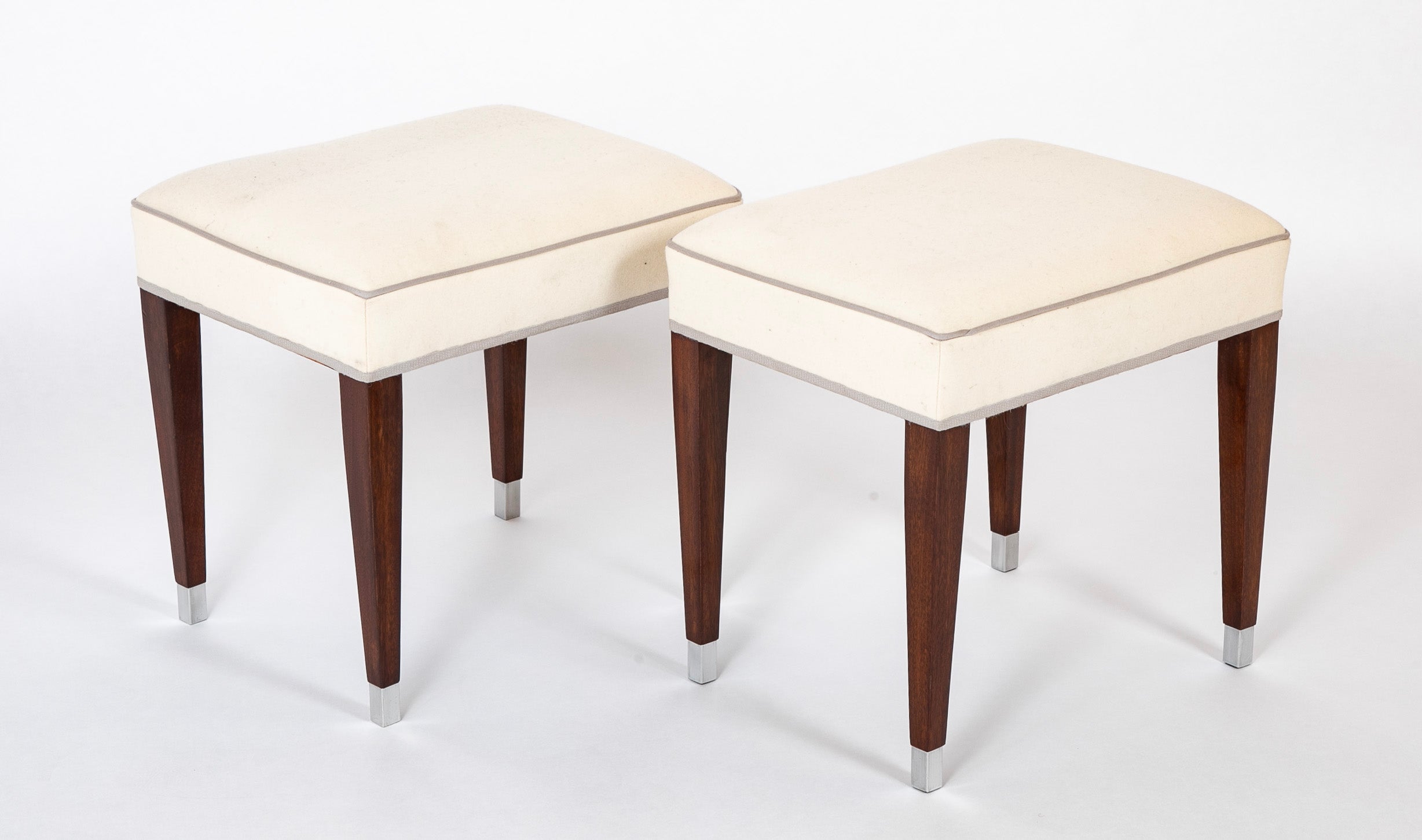 A Pair of Upholstered Stools by Jacques Adnet