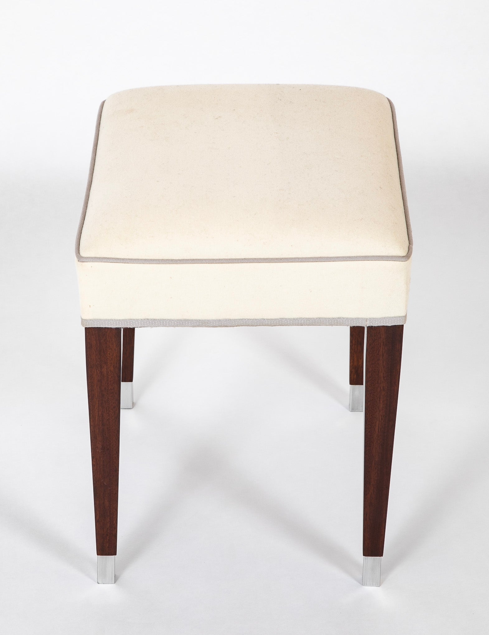 A Pair of Upholstered Stools by Jacques Adnet