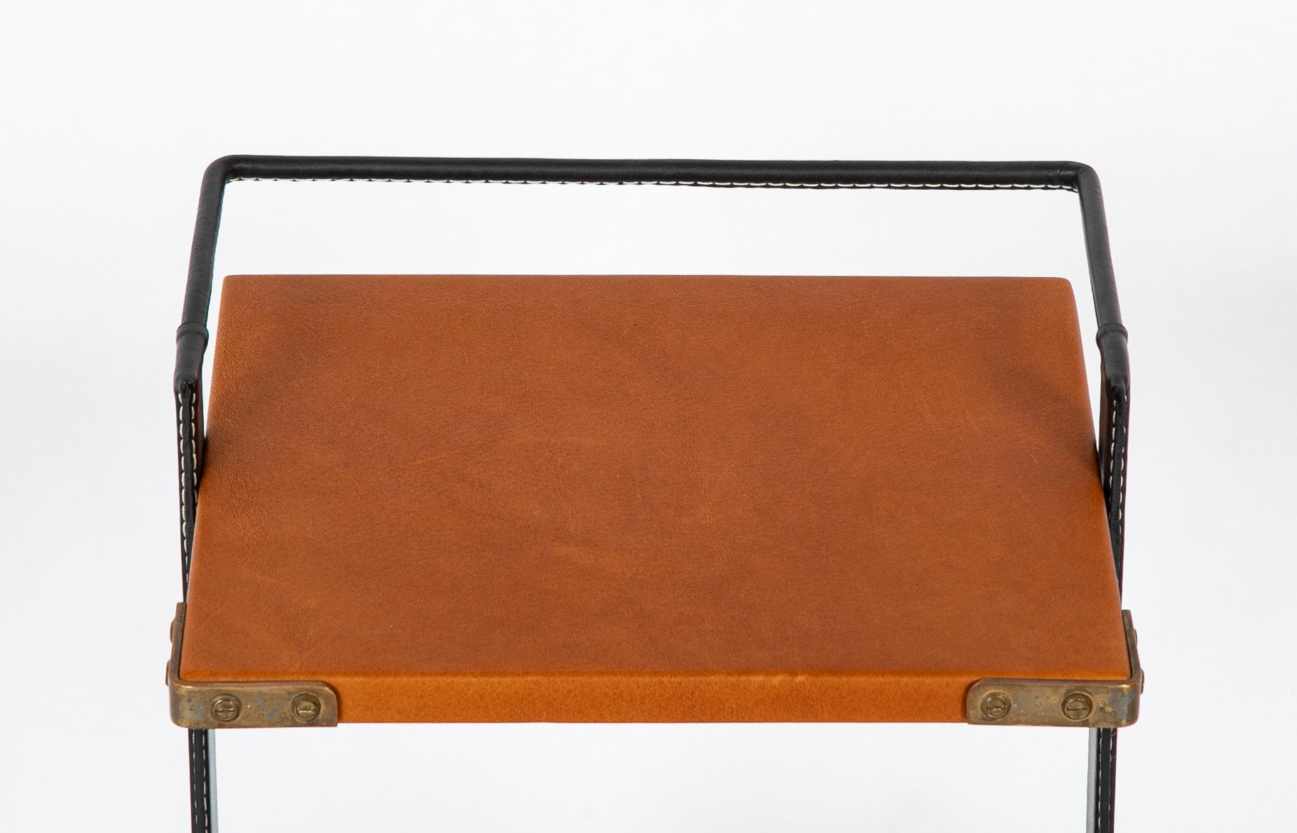 A Jacques Adnet Black and Cognac Leather over Metal Frame Table