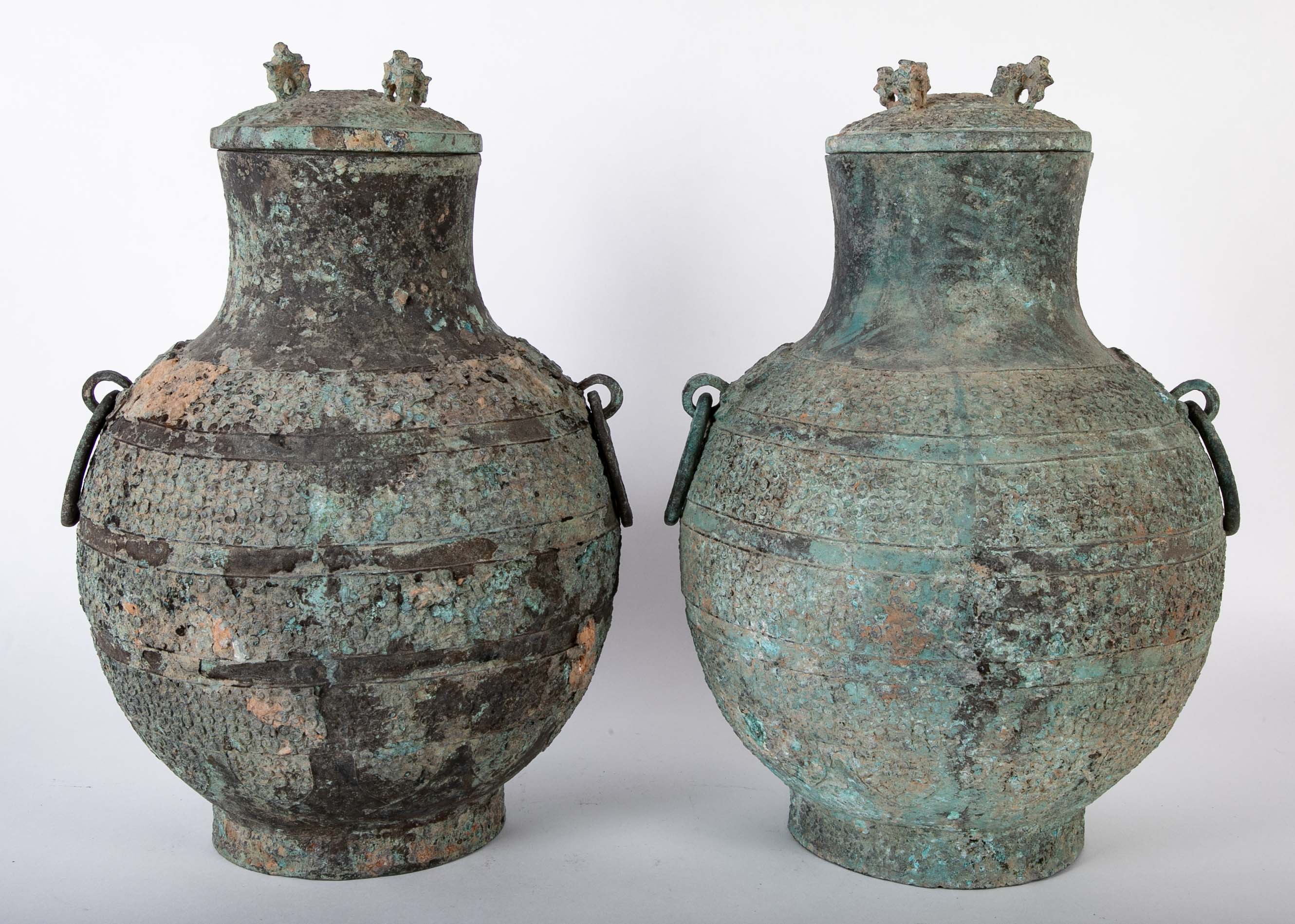 A Pair of Chinese "Warring States" Period Bronze Lidded Wine Vessels