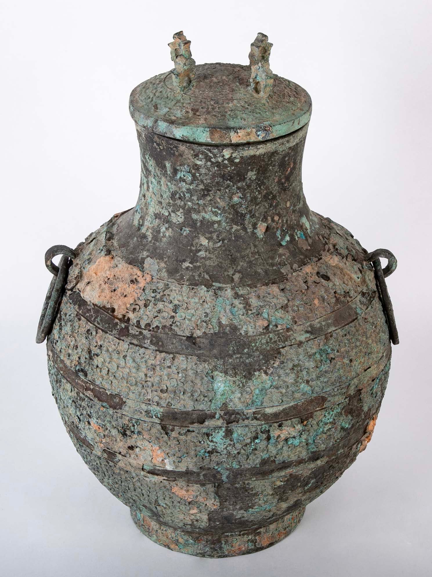 A Pair of Chinese "Warring States" Period Bronze Lidded Wine Vessels