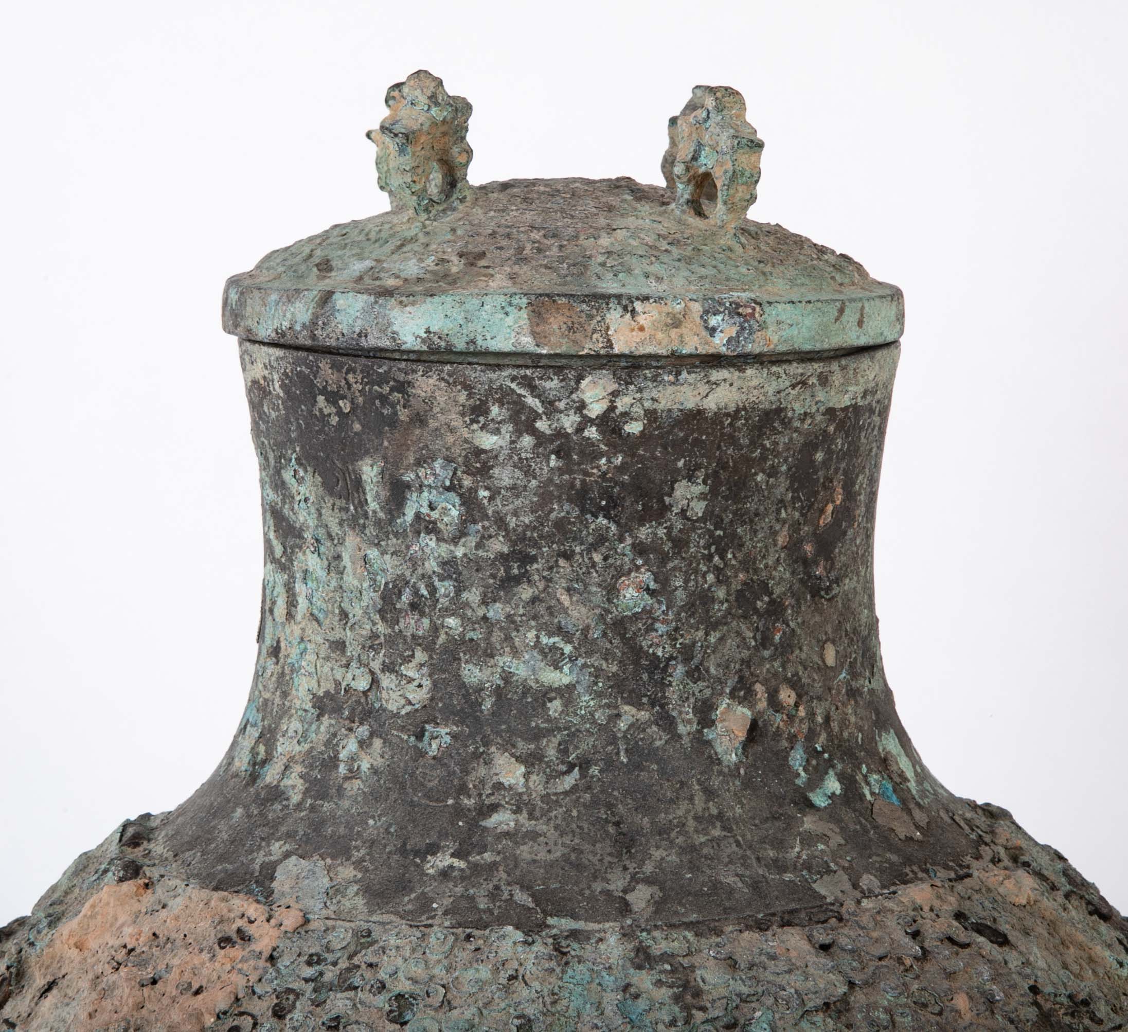 A Pair of Chinese "Warring States" Period Bronze Lidded Wine Vessels
