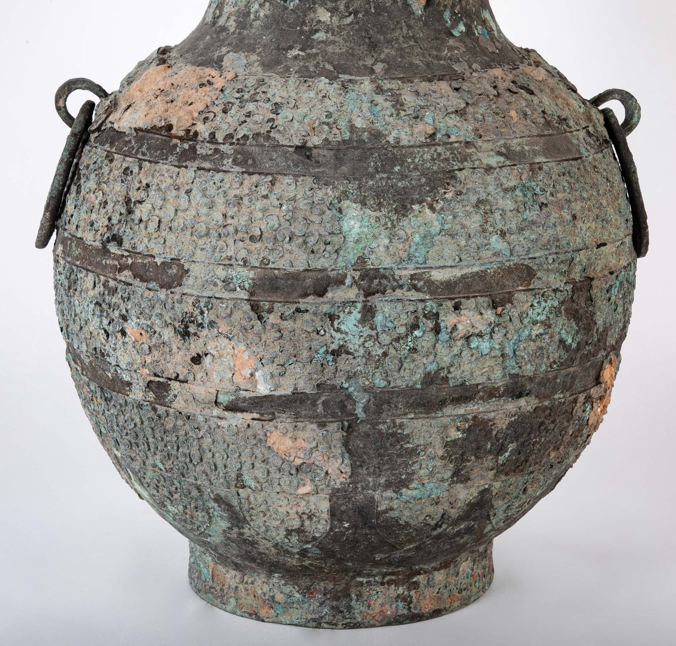 A Pair of Chinese "Warring States" Period Bronze Lidded Wine Vessels