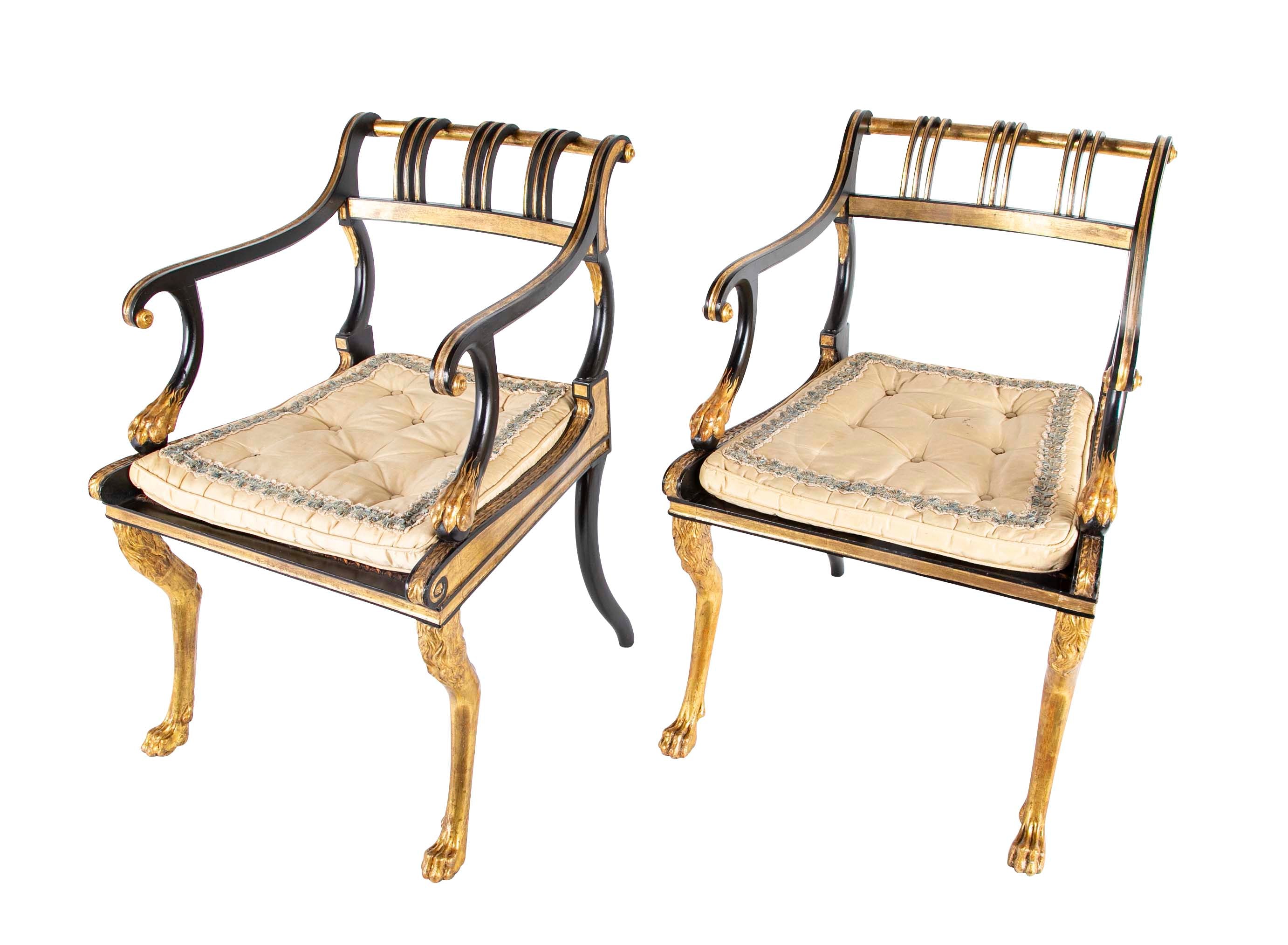 A Pair of Regency Style Ebonized and Parcel Gilt Armchairs