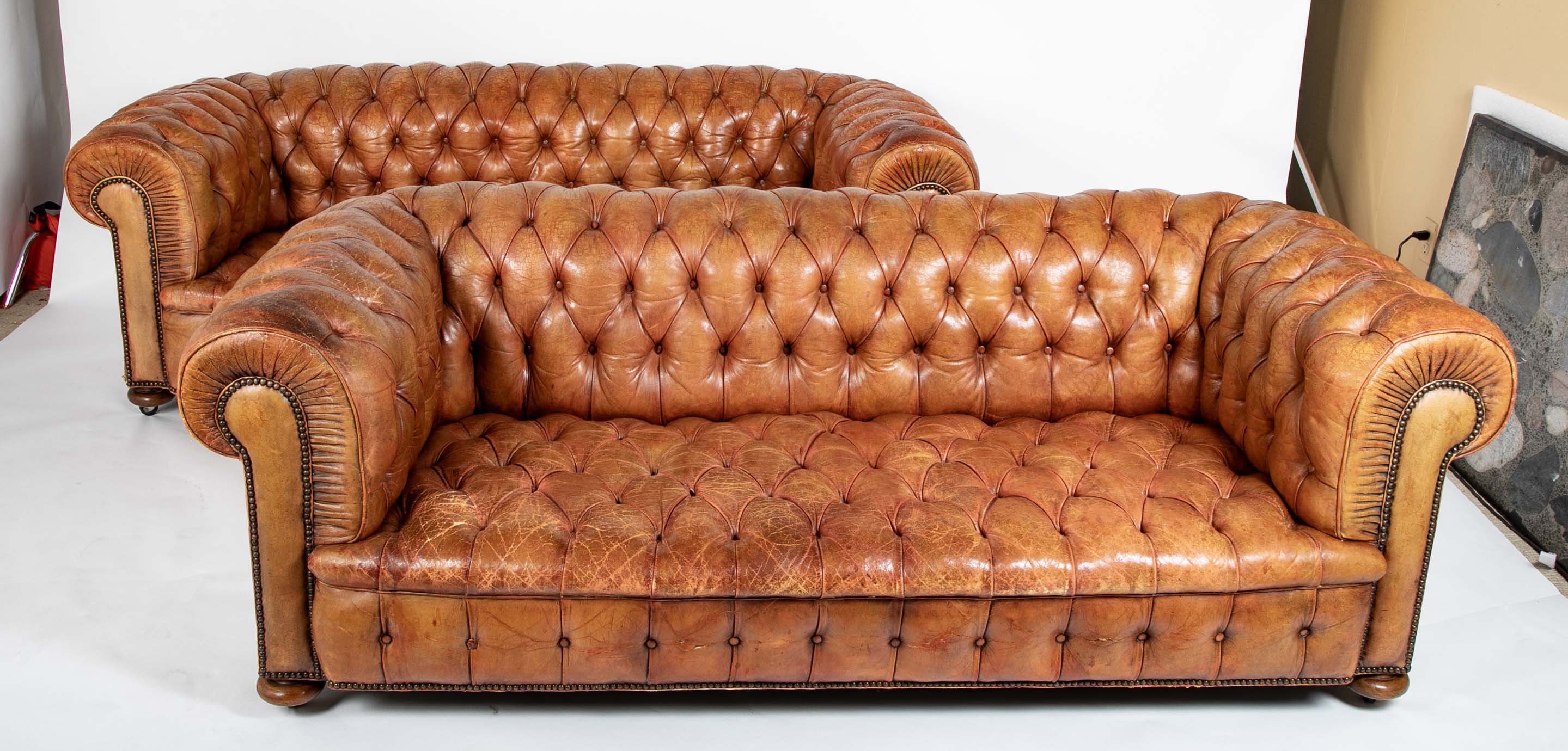 Pair of Mid 20th Century English Chesterfield Sofas in Coral Leather