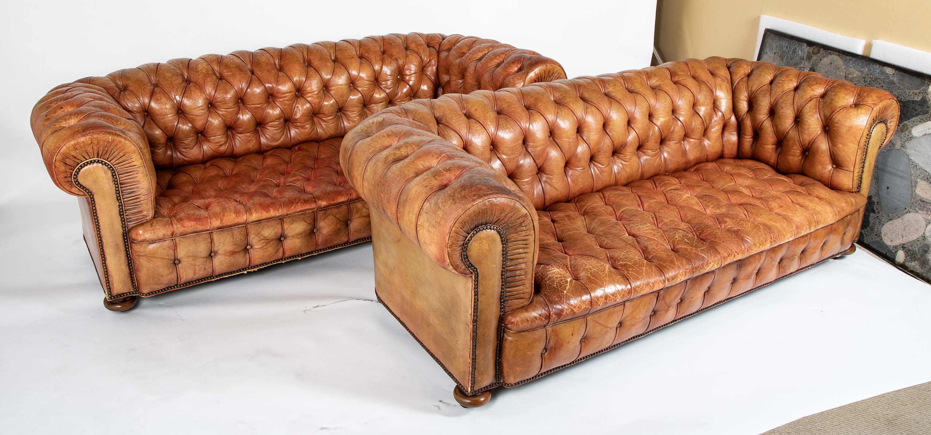 Pair of Mid 20th Century English Chesterfield Sofas in Coral Leather