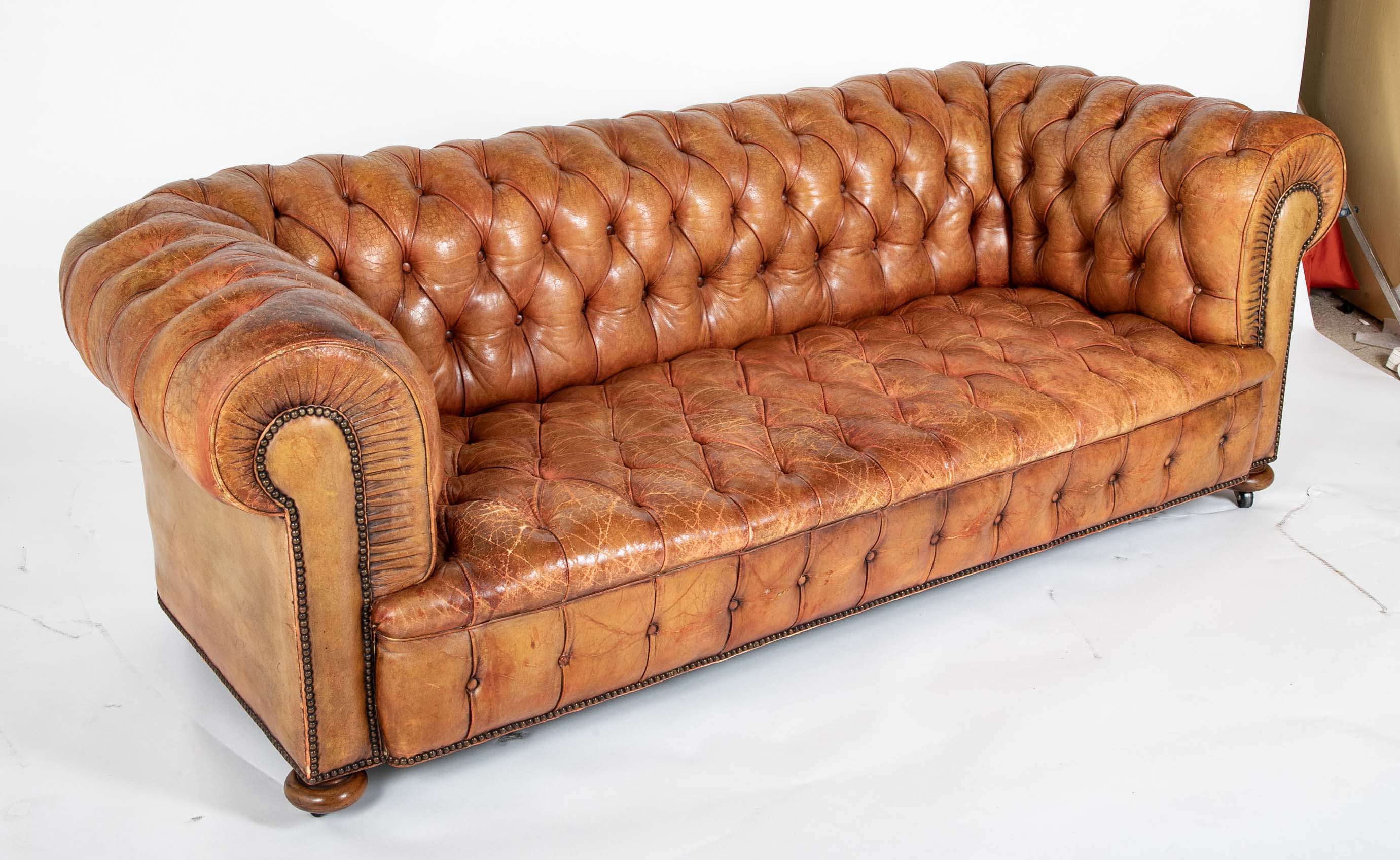 Pair of Mid 20th Century English Chesterfield Sofas in Coral Leather