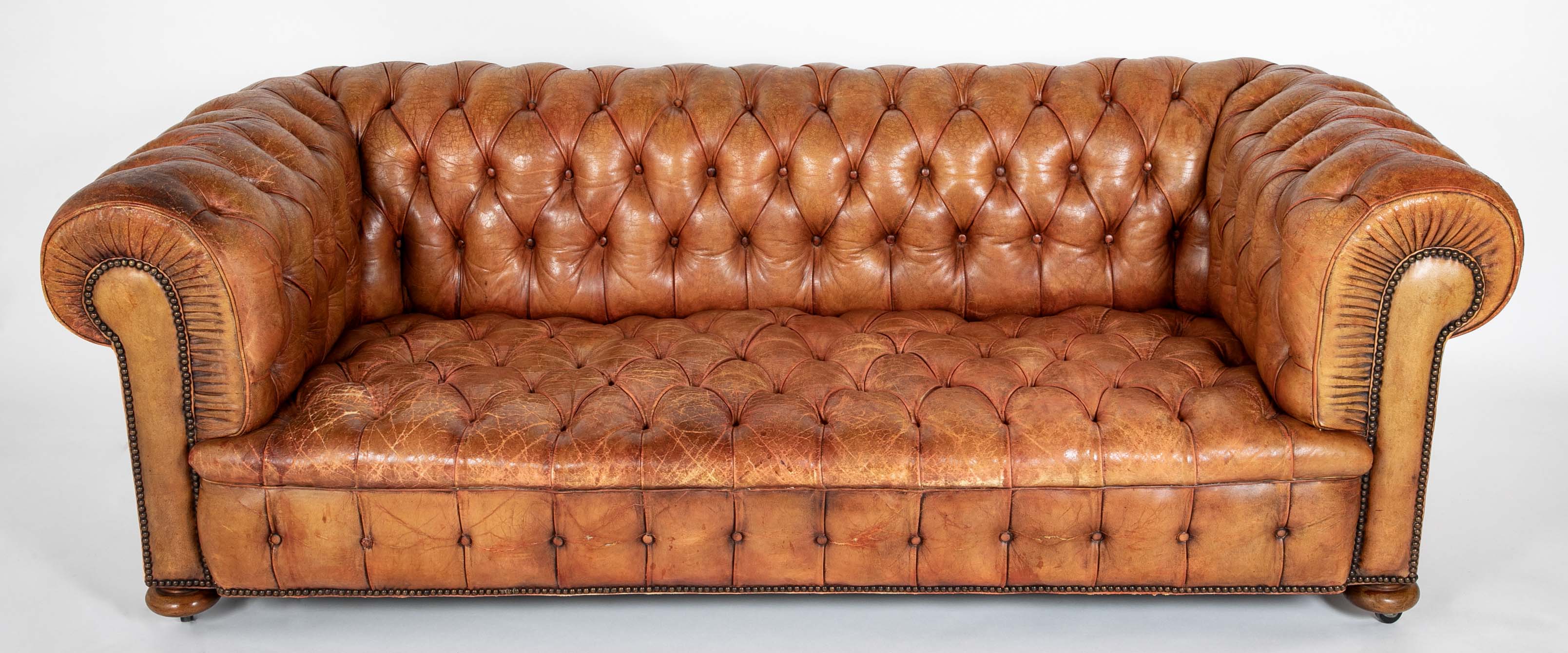 Pair of Mid 20th Century English Chesterfield Sofas in Coral Leather