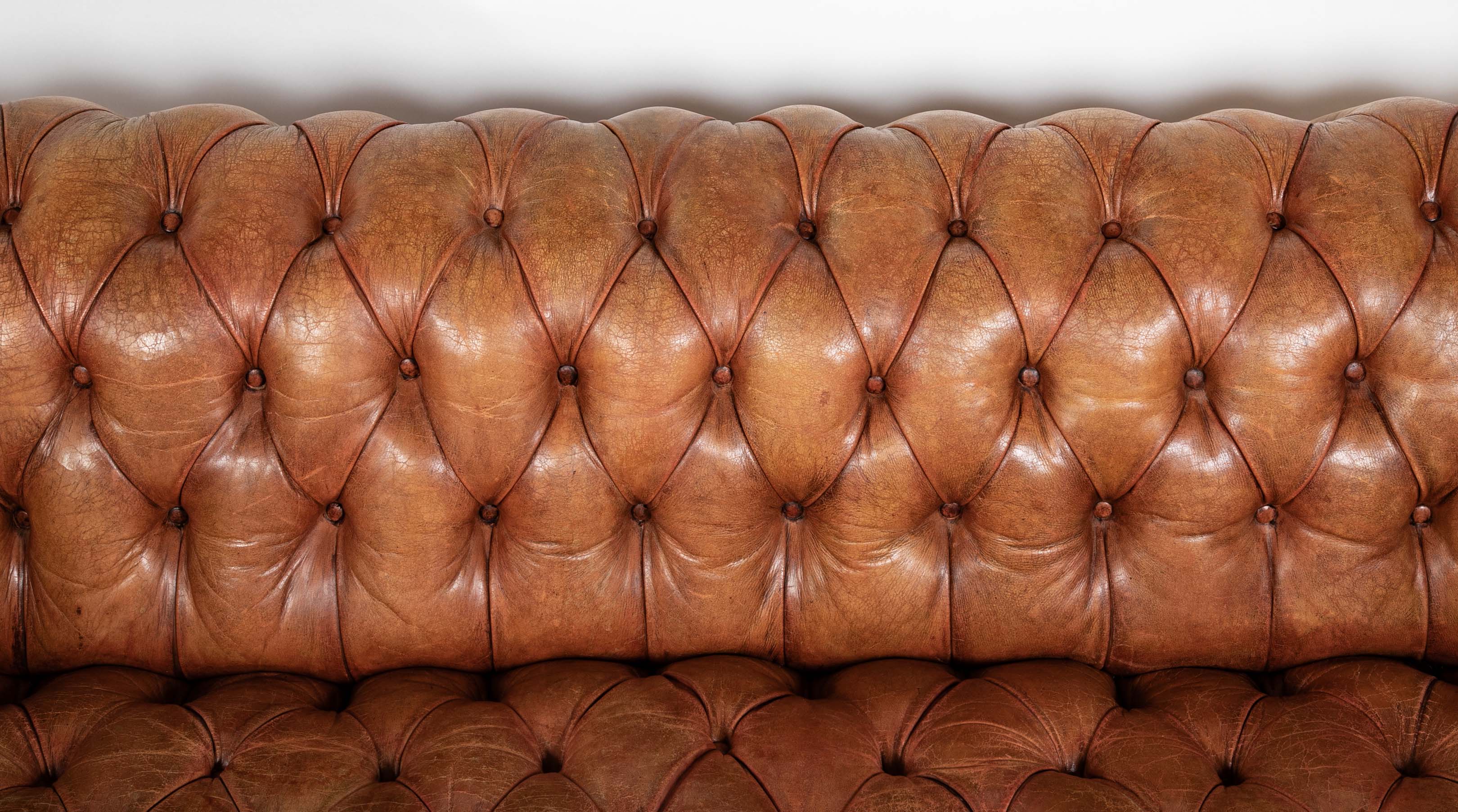 Pair of Mid 20th Century English Chesterfield Sofas in Coral Leather
