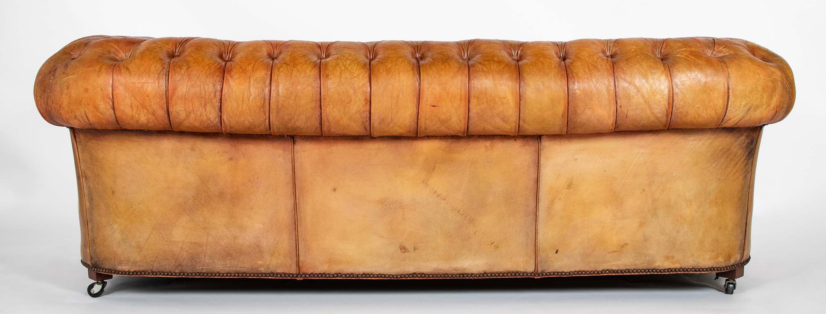 Pair of Mid 20th Century English Chesterfield Sofas in Coral Leather