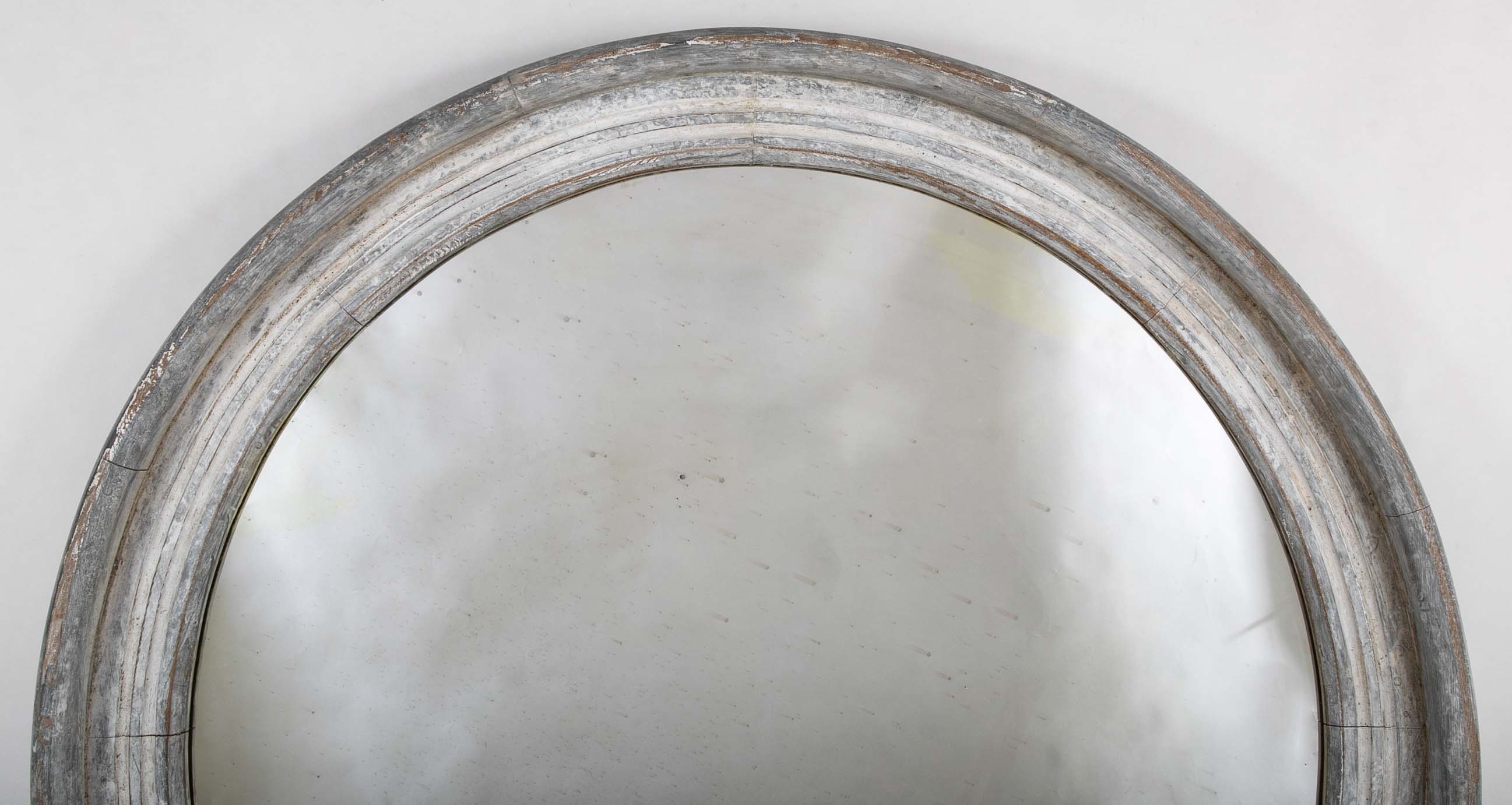 A Round Swedish Mirror with Whitewashed & Patinated Heavy Wood Frame