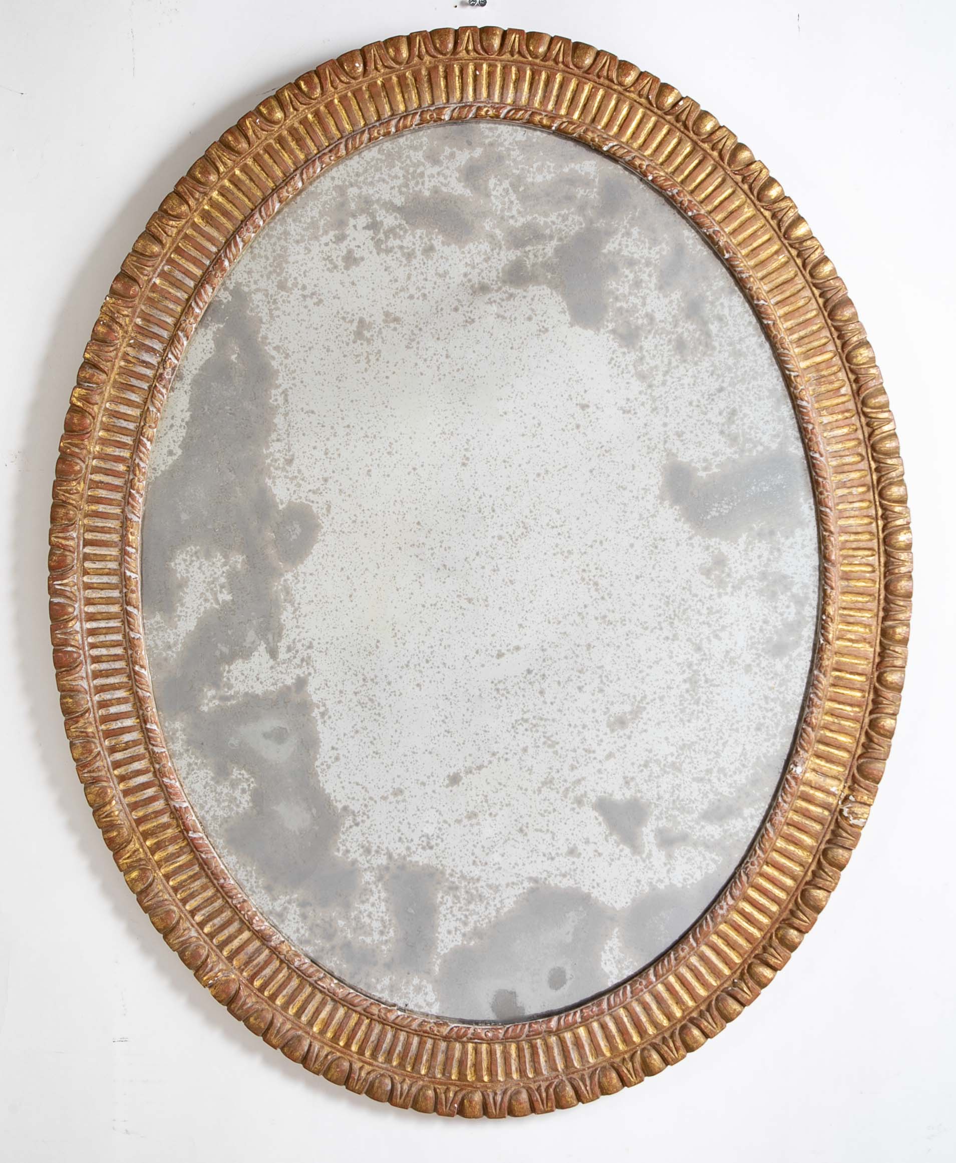 A George III Style Carved Giltwood Oval Mirror