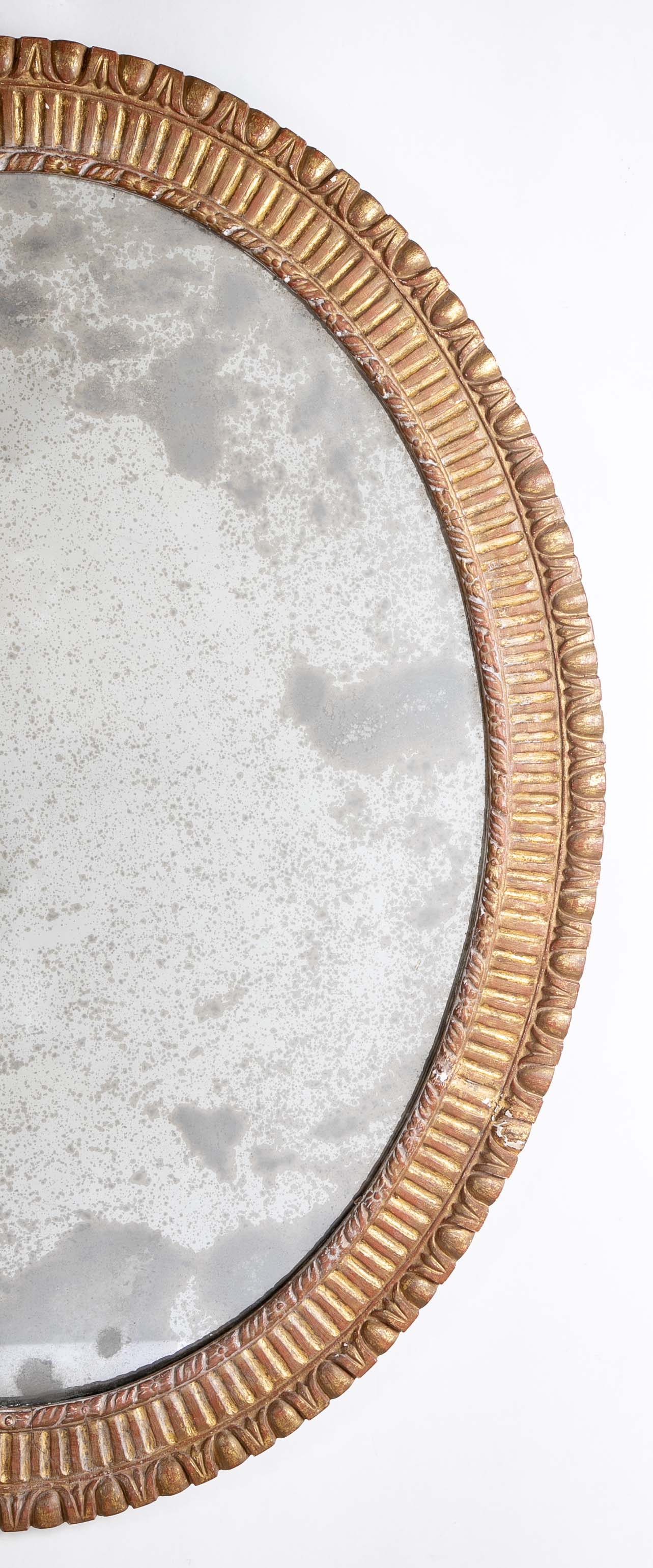 A George III Style Carved Giltwood Oval Mirror