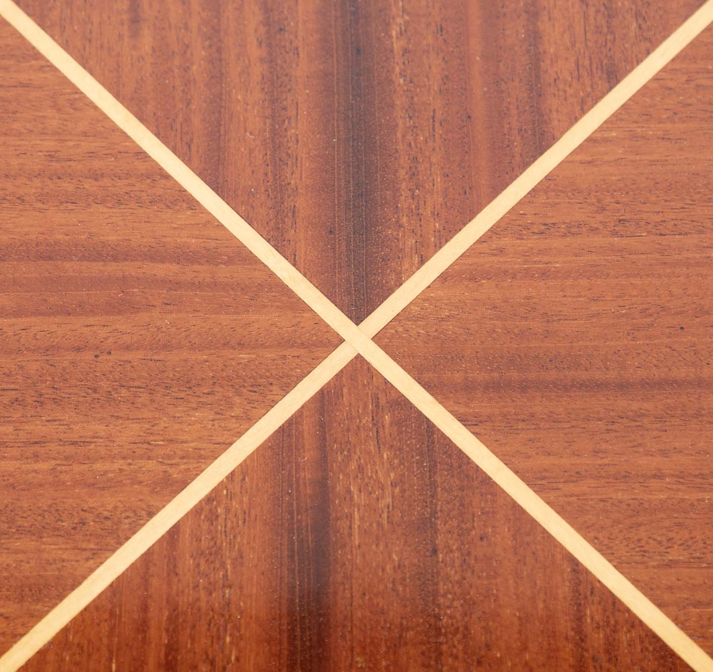 A Tommi Parzinger for Charak Modern Mahogany and Maple Dining Table with Leaves.
