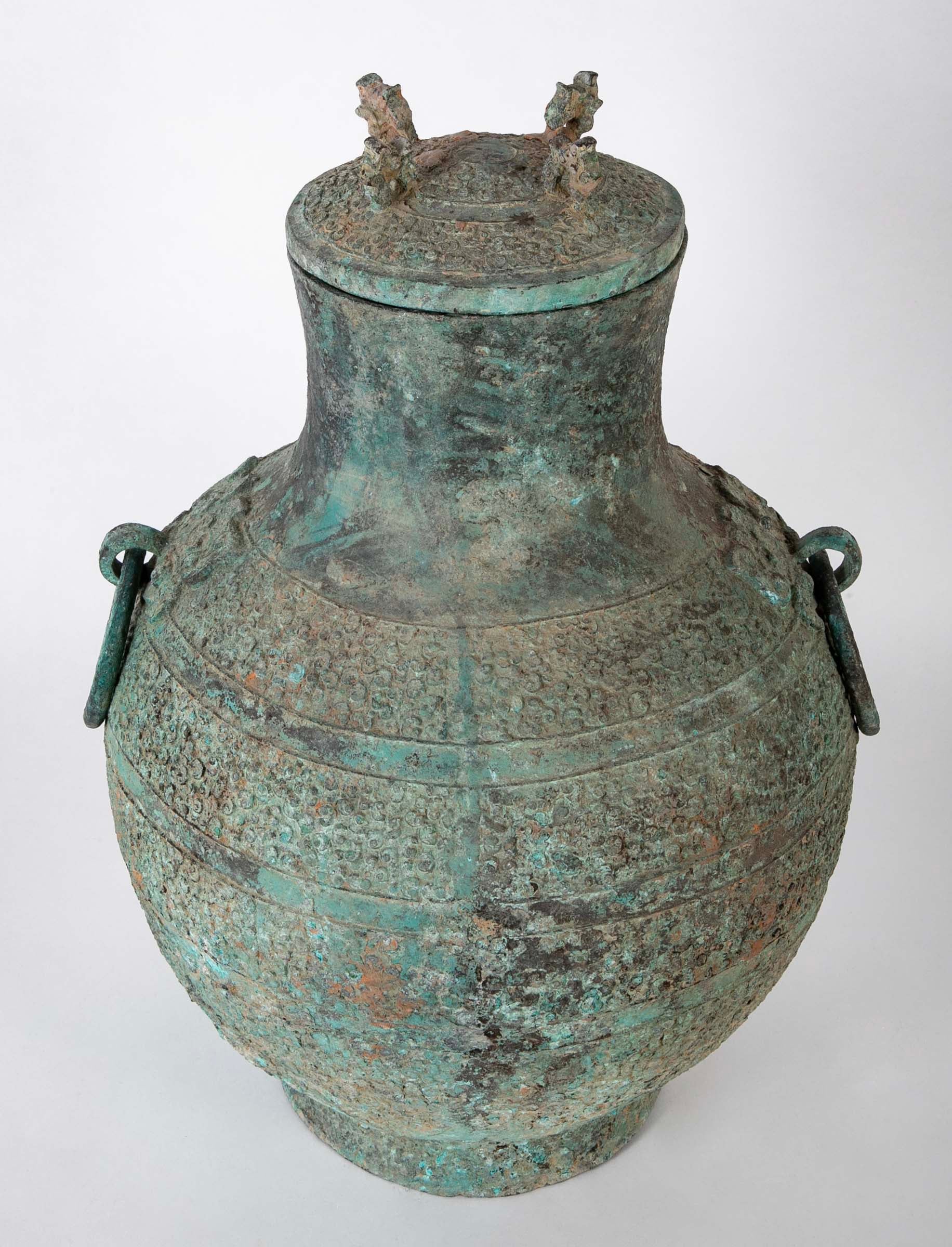 A Pair of Chinese "Warring States" Period Bronze Lidded Wine Vessels