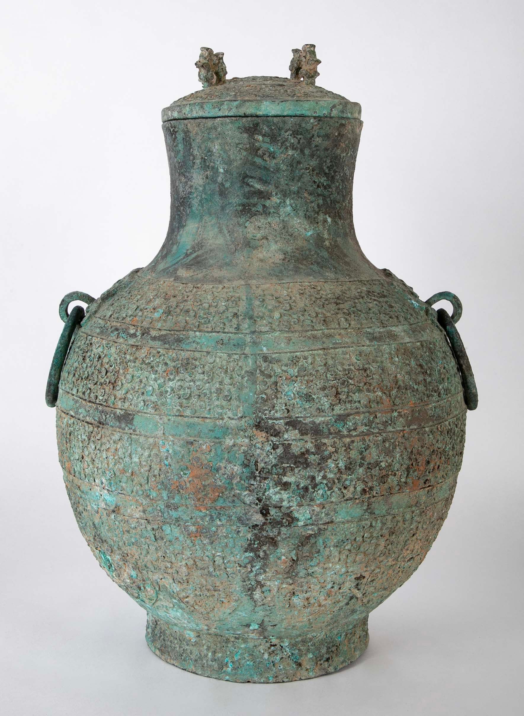 A Pair of Chinese "Warring States" Period Bronze Lidded Wine Vessels
