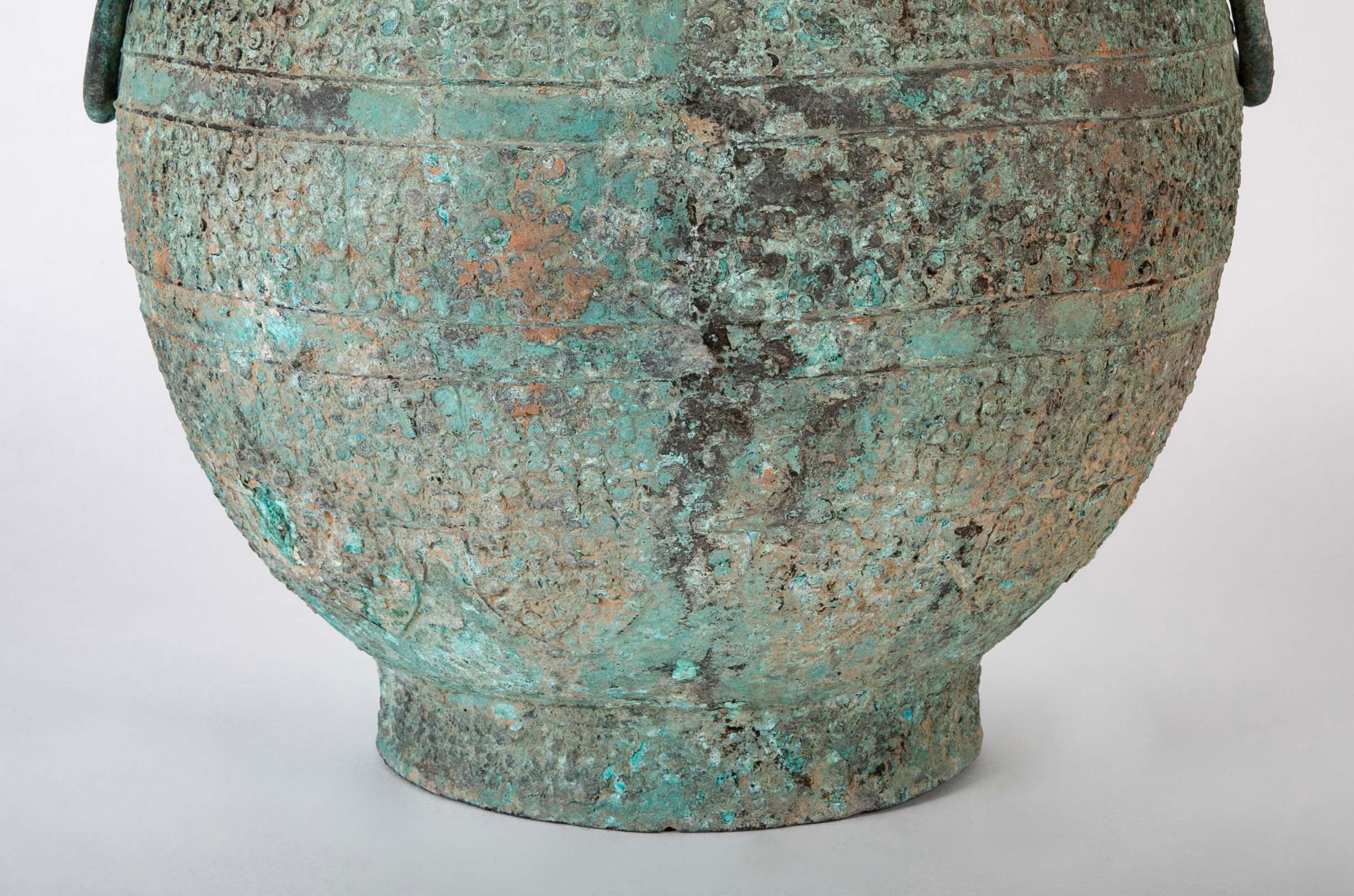 A Pair of Chinese "Warring States" Period Bronze Lidded Wine Vessels