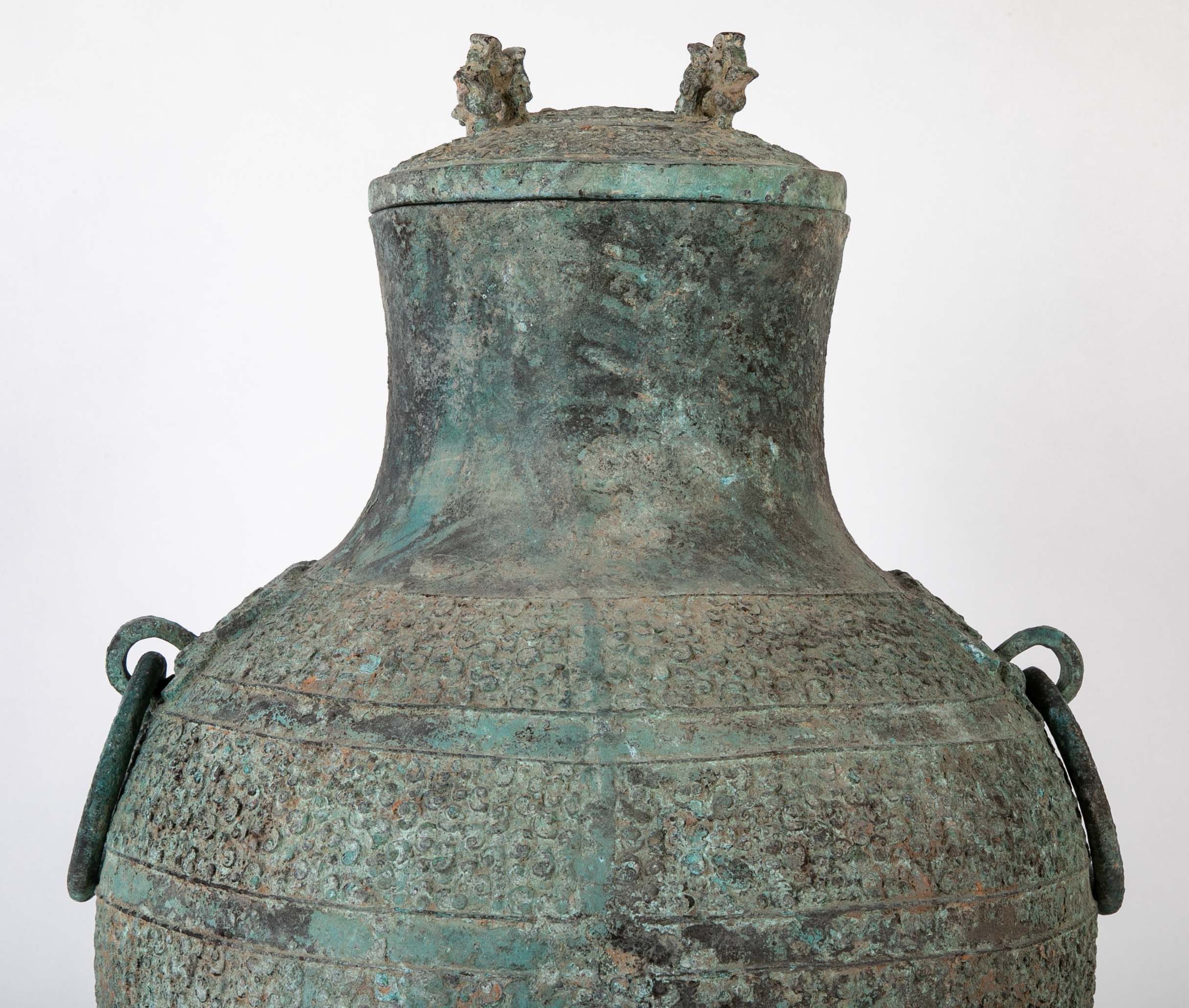 A Pair of Chinese "Warring States" Period Bronze Lidded Wine Vessels