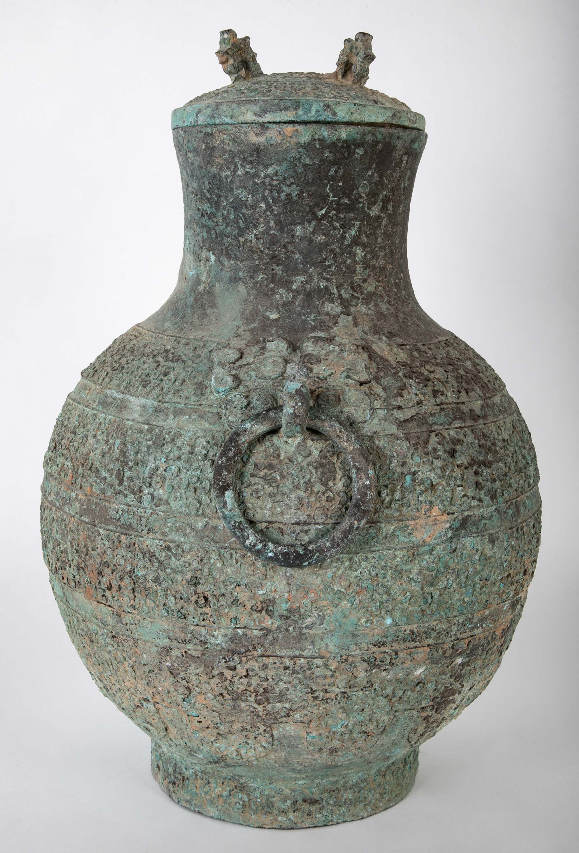 A Pair of Chinese "Warring States" Period Bronze Lidded Wine Vessels