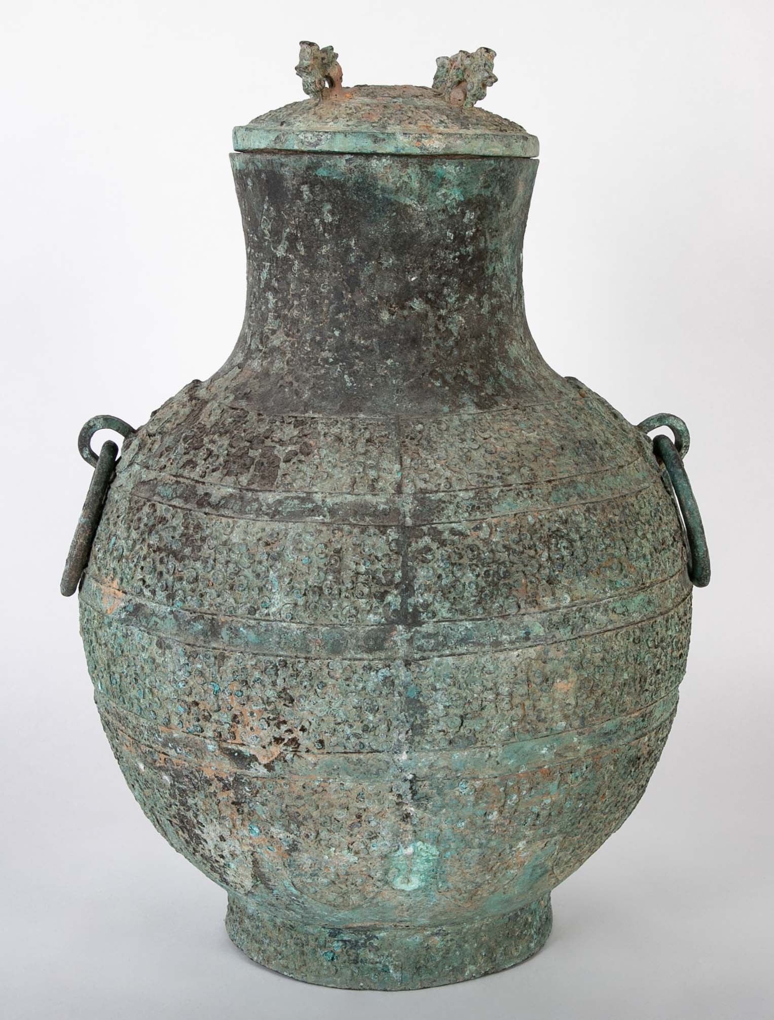 A Pair of Chinese "Warring States" Period Bronze Lidded Wine Vessels