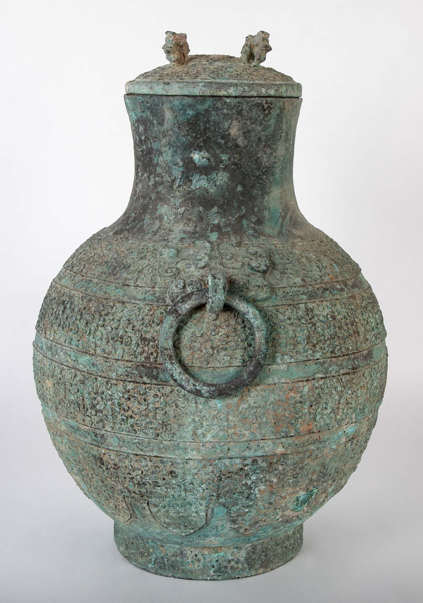 A Pair of Chinese "Warring States" Period Bronze Lidded Wine Vessels