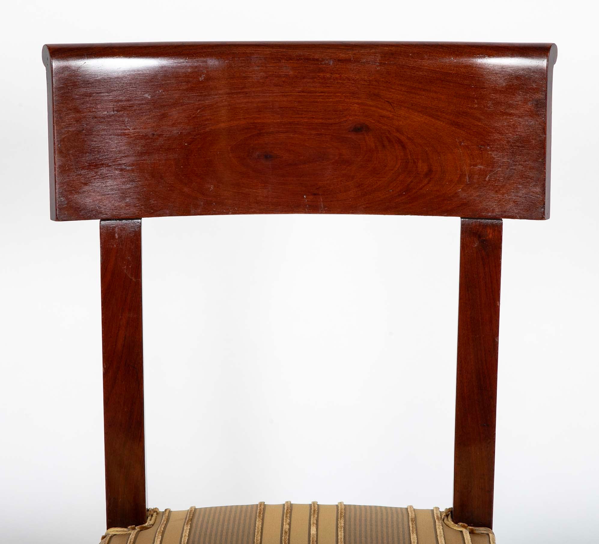 A Rare Set of 12 Restauration / Empire Dining Chairs of Classic Design