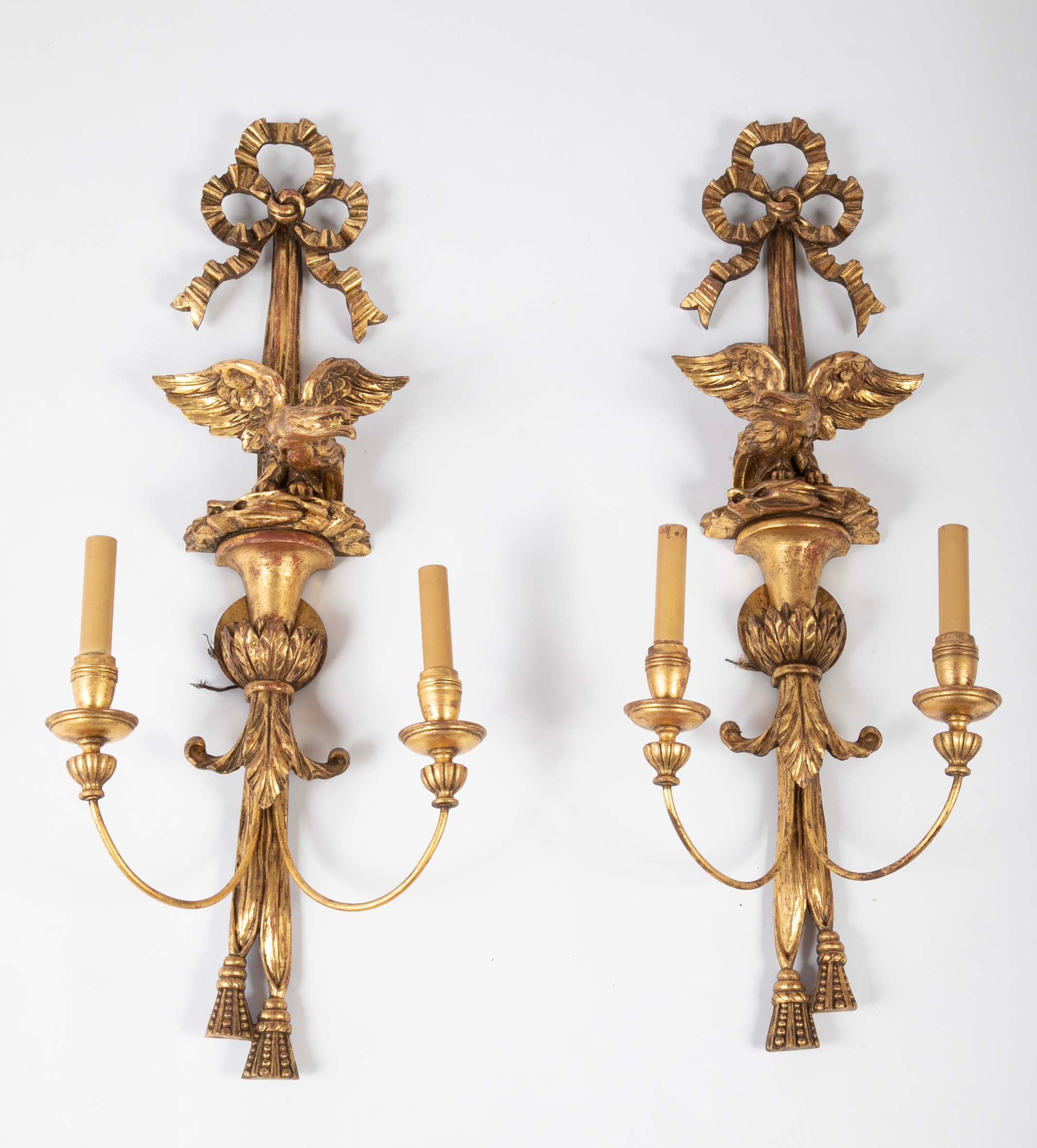A Pair of Carved and Gilded Two Light Eagle Wall Sconces
