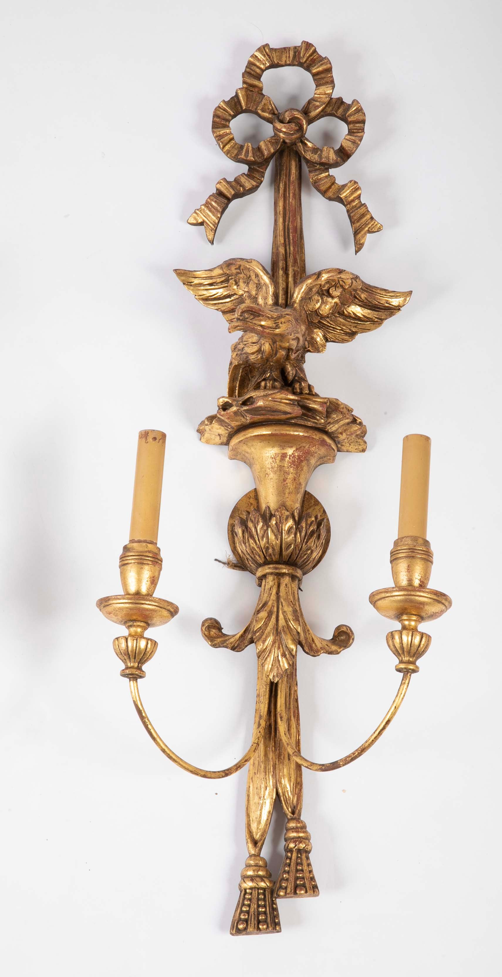 A Pair of Carved and Gilded Two Light Eagle Wall Sconces