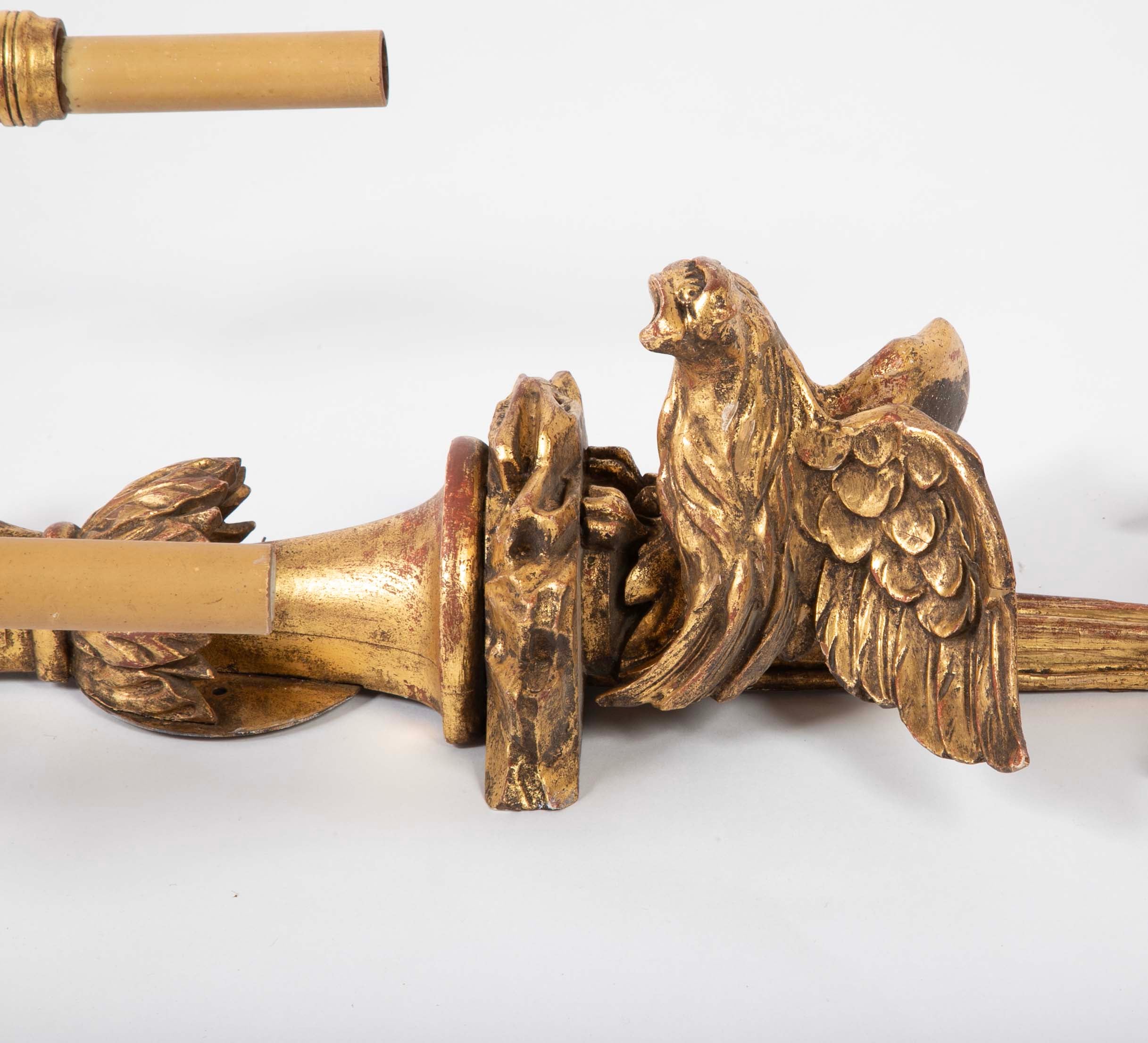 A Pair of Carved and Gilded Two Light Eagle Wall Sconces