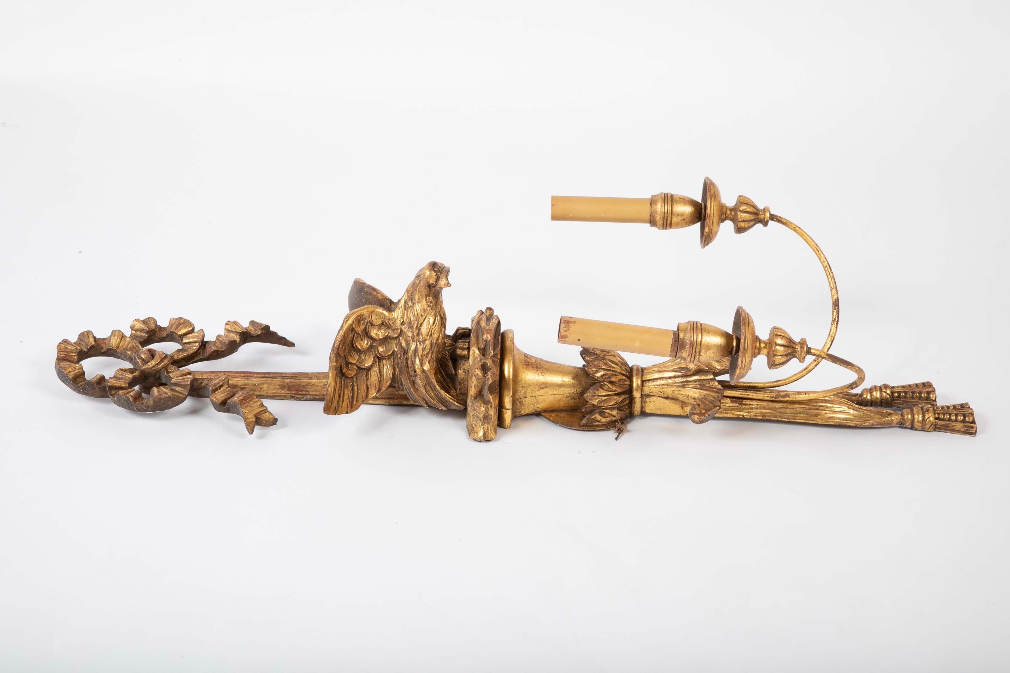 A Pair of Carved and Gilded Two Light Eagle Wall Sconces