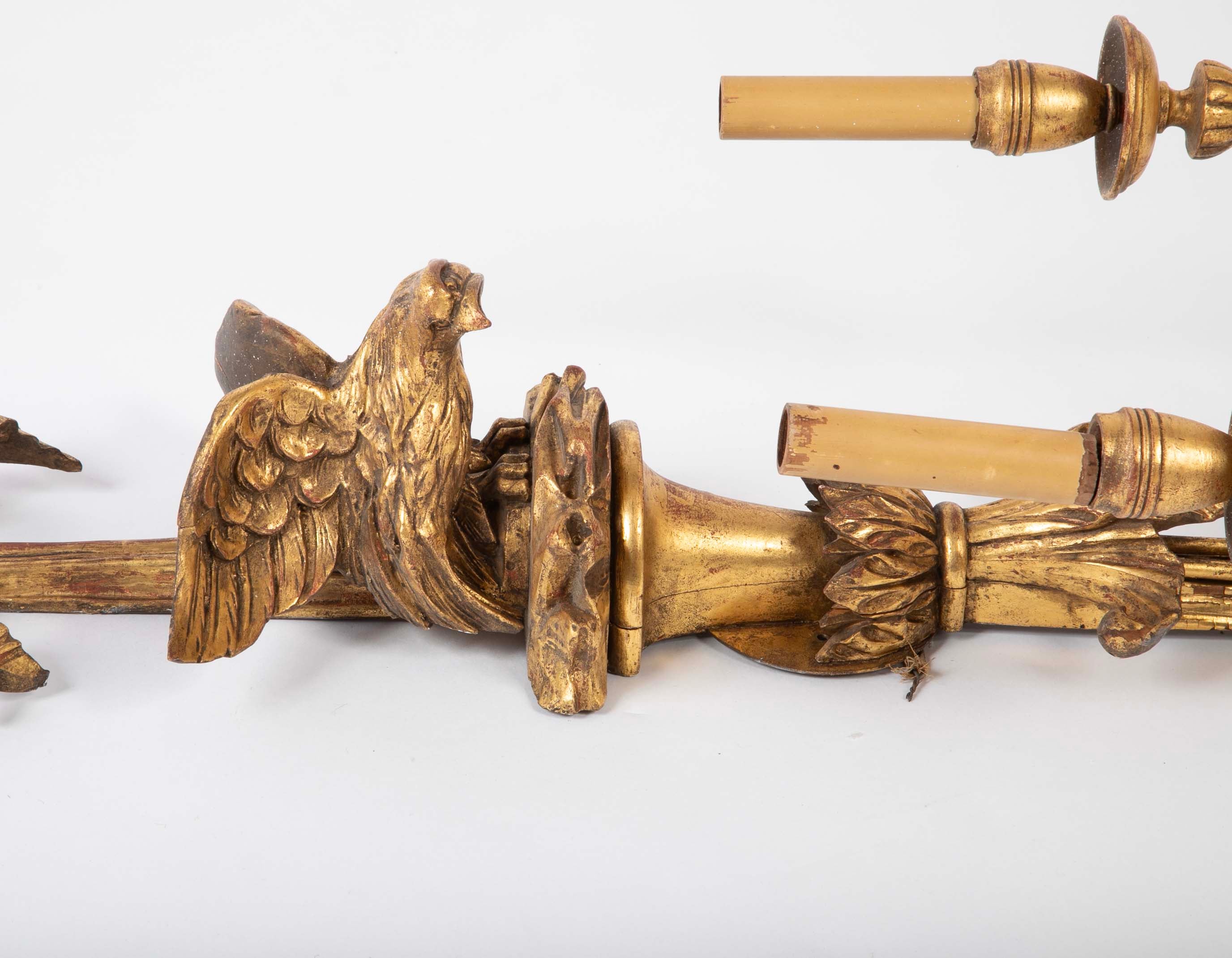 A Pair of Carved and Gilded Two Light Eagle Wall Sconces