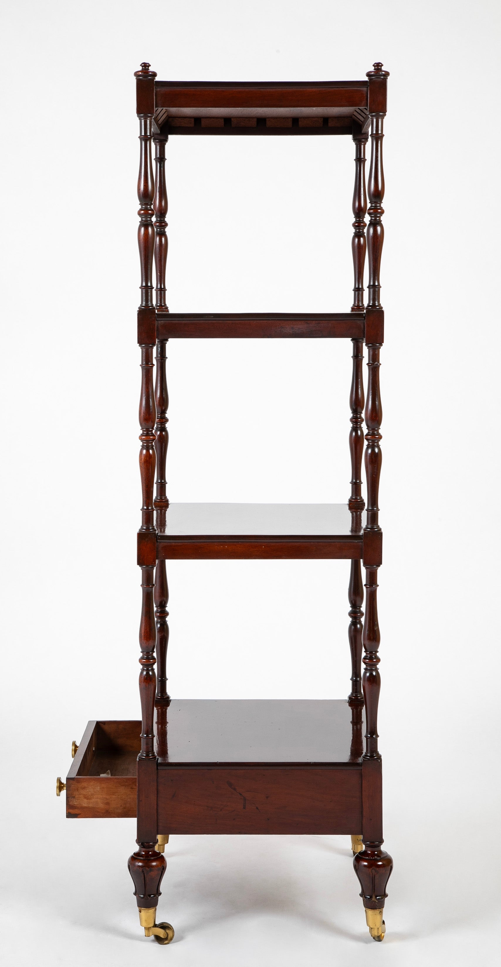 A Regency Four Tier Etagere with Rare Lotus Carved Legs