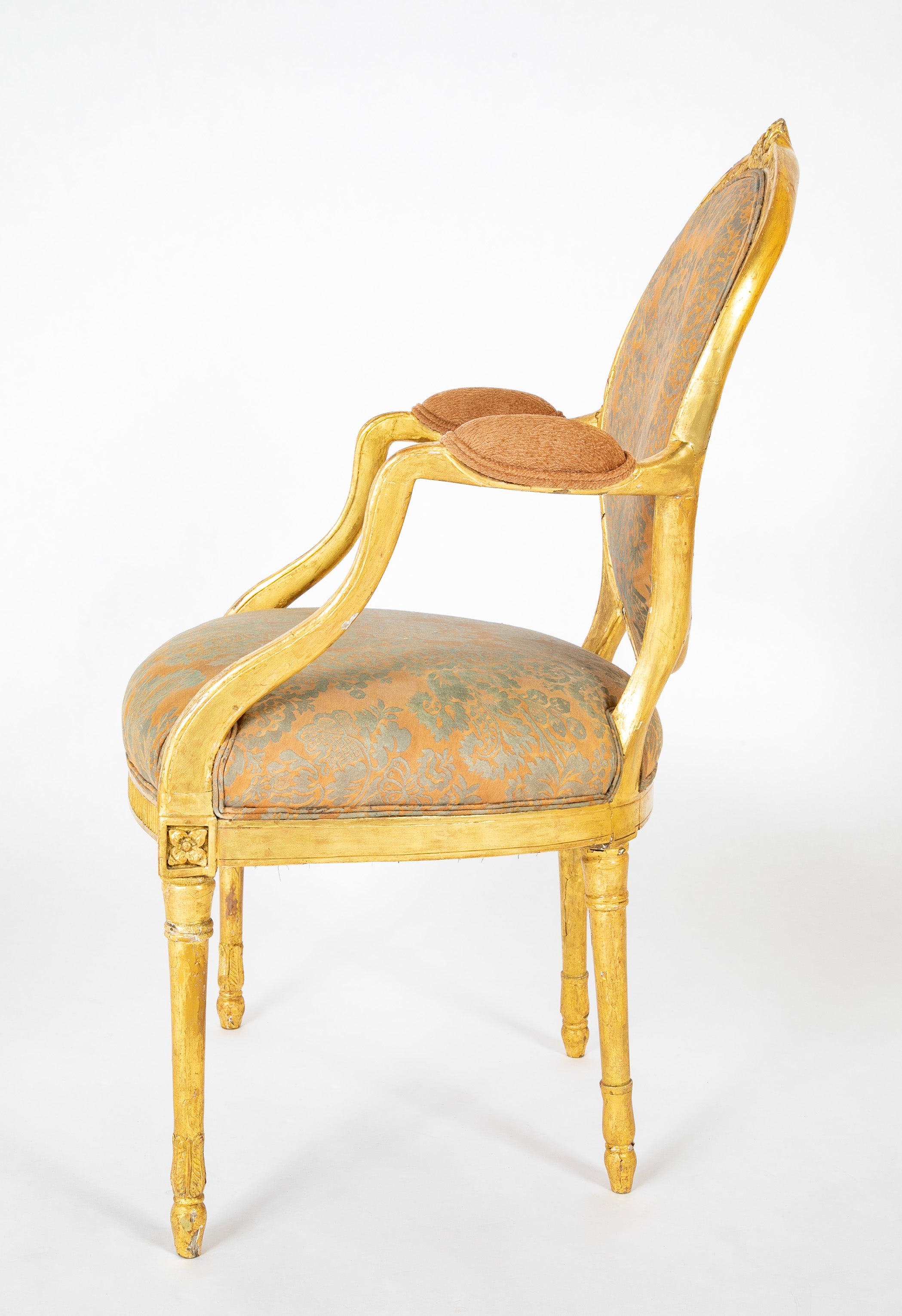 A Pair of George III Period Giltwood Oval Back "Elbow" Chairs