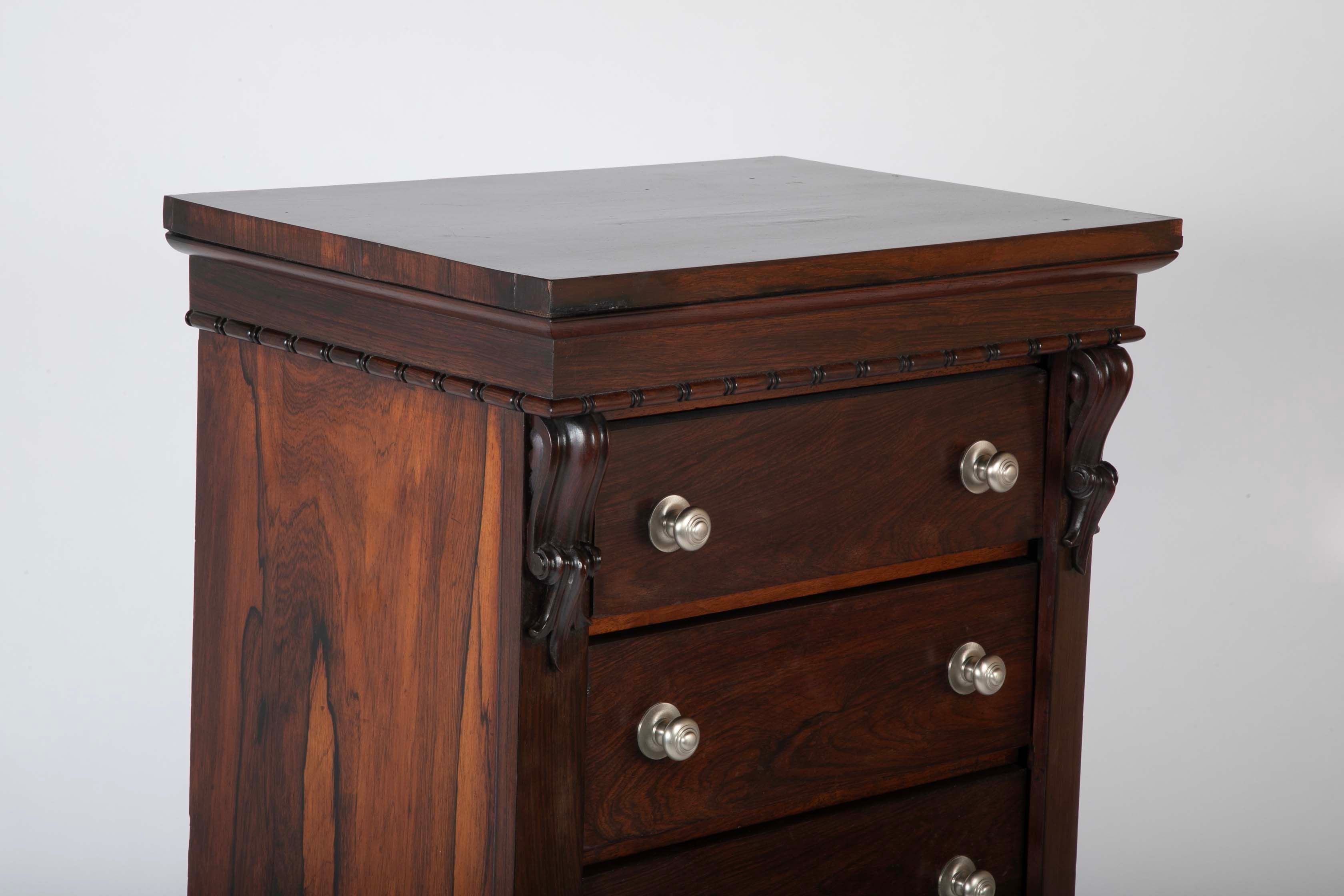 A 19th Century Brazilian Rosewood Six Drawer Wellington High Cabinet