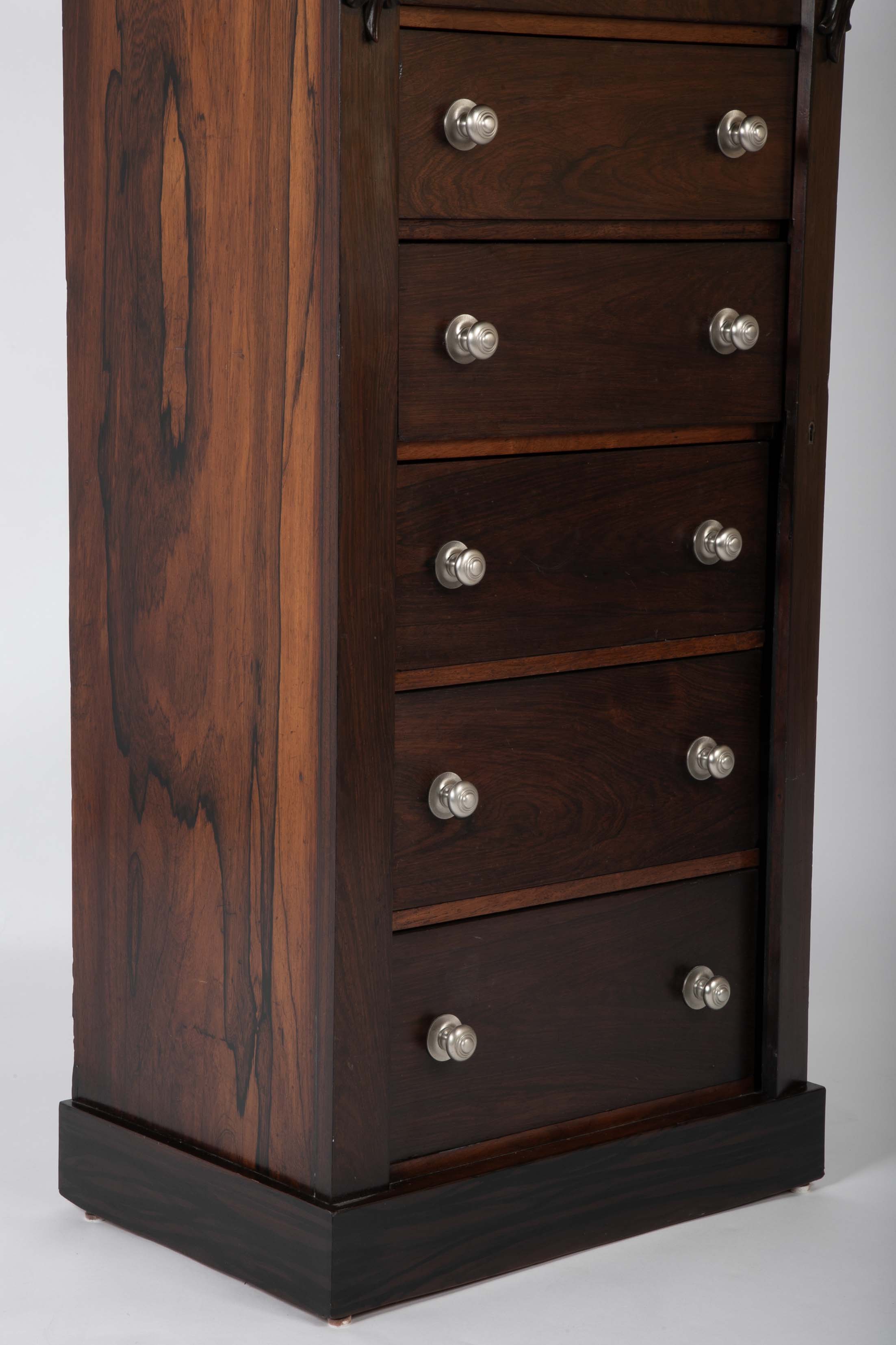 A 19th Century Brazilian Rosewood Six Drawer Wellington High Cabinet