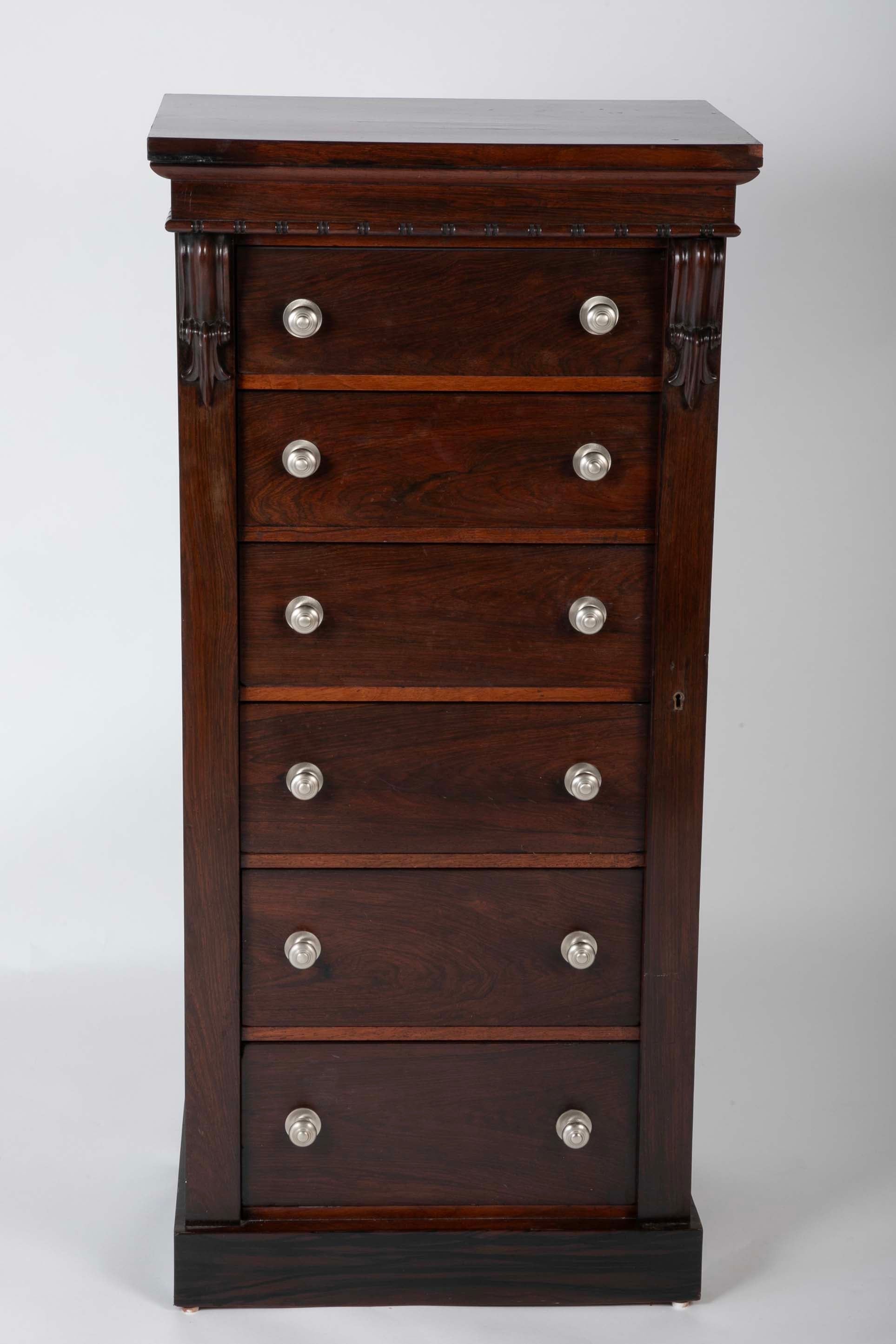 A 19th Century Brazilian Rosewood Six Drawer Wellington High Cabinet