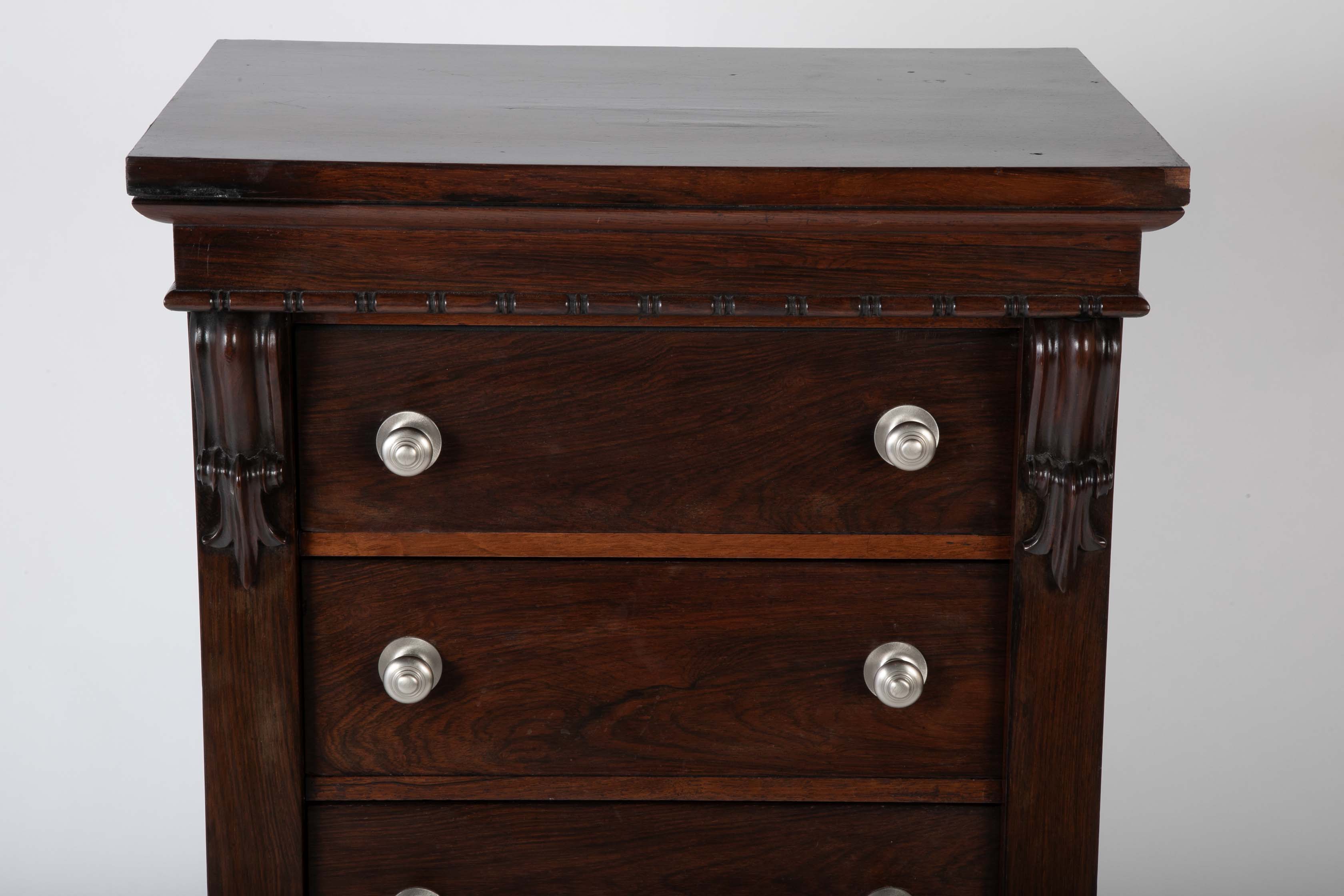 A 19th Century Brazilian Rosewood Six Drawer Wellington High Cabinet