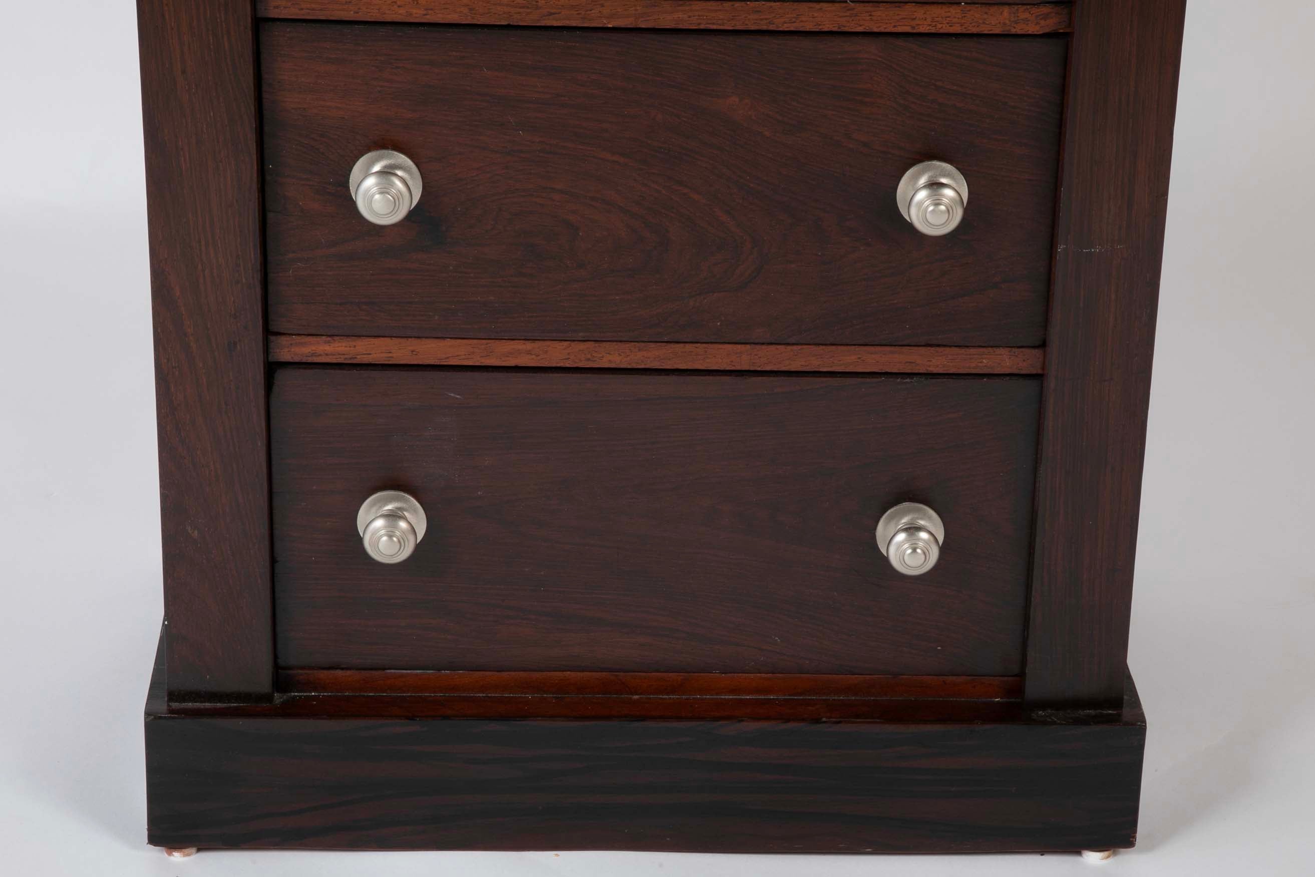 A 19th Century Brazilian Rosewood Six Drawer Wellington High Cabinet