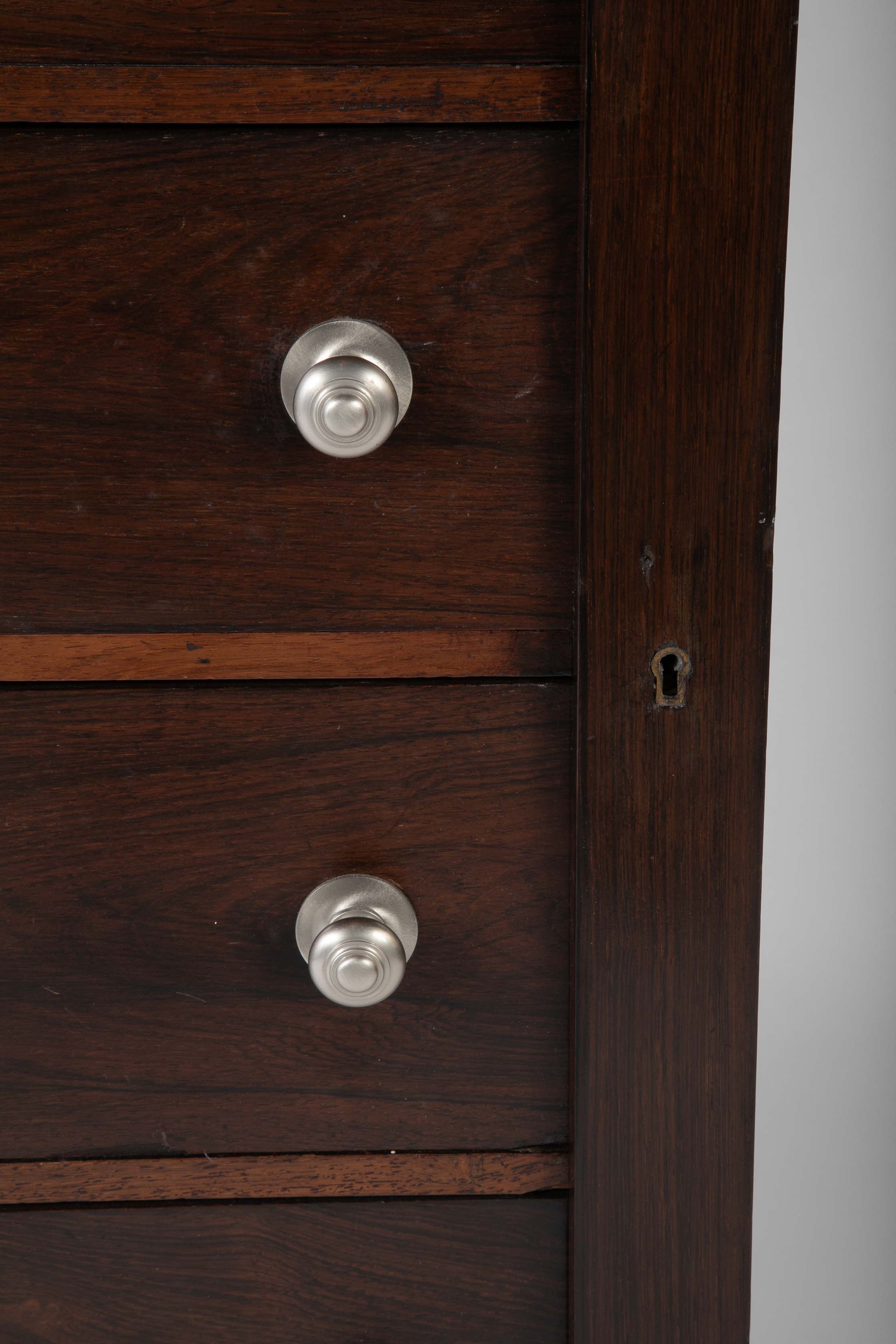 A 19th Century Brazilian Rosewood Six Drawer Wellington High Cabinet