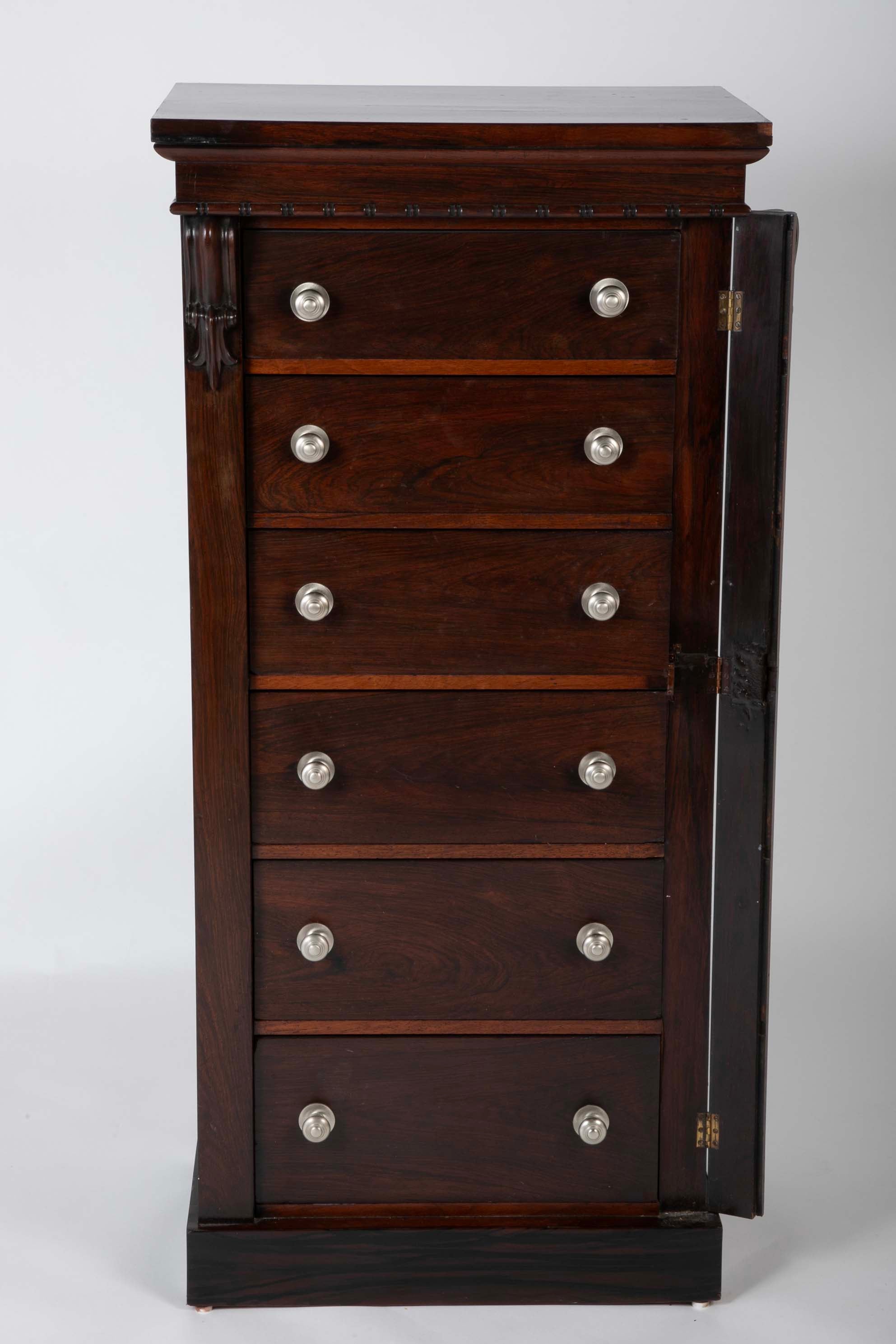 A 19th Century Brazilian Rosewood Six Drawer Wellington High Cabinet