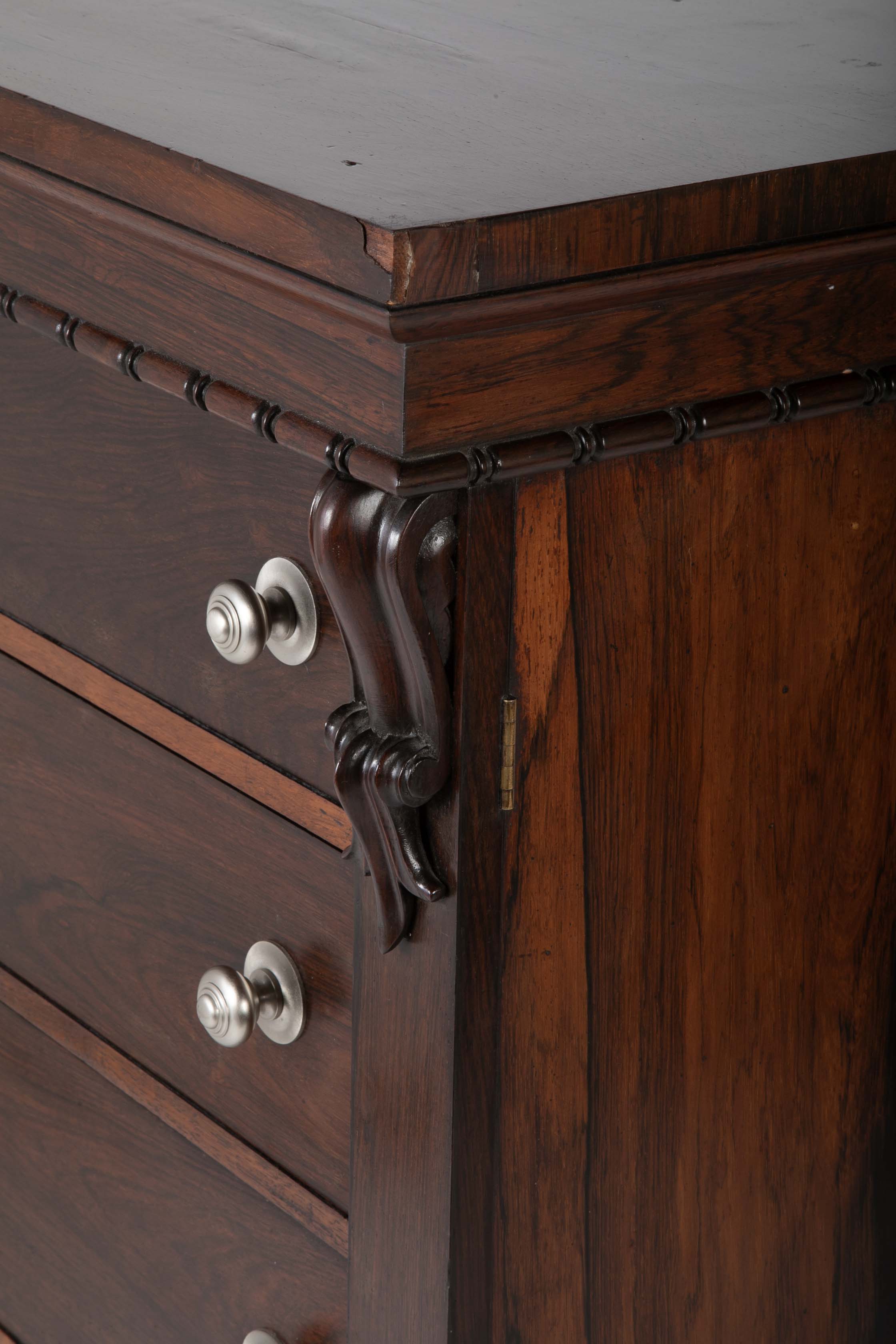 A 19th Century Brazilian Rosewood Six Drawer Wellington High Cabinet