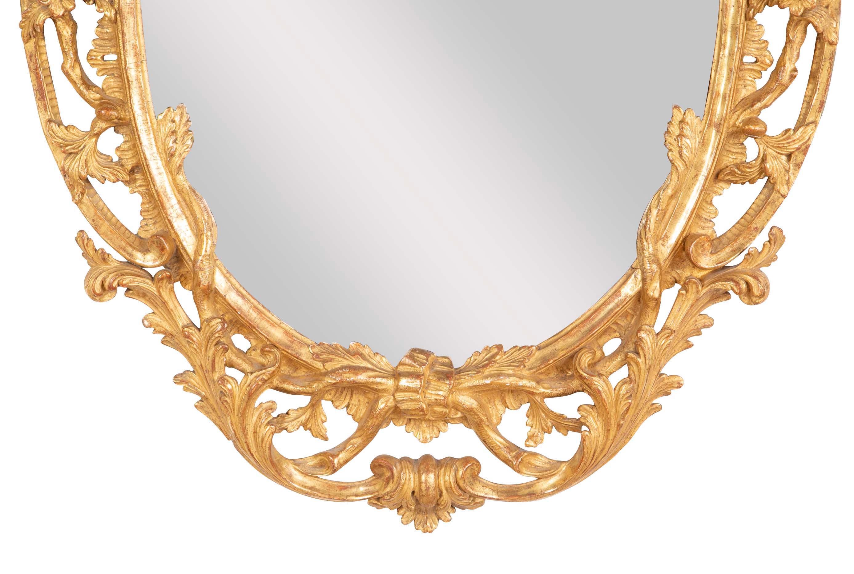 Pair of English George II Period Oval Gilt Mirrors