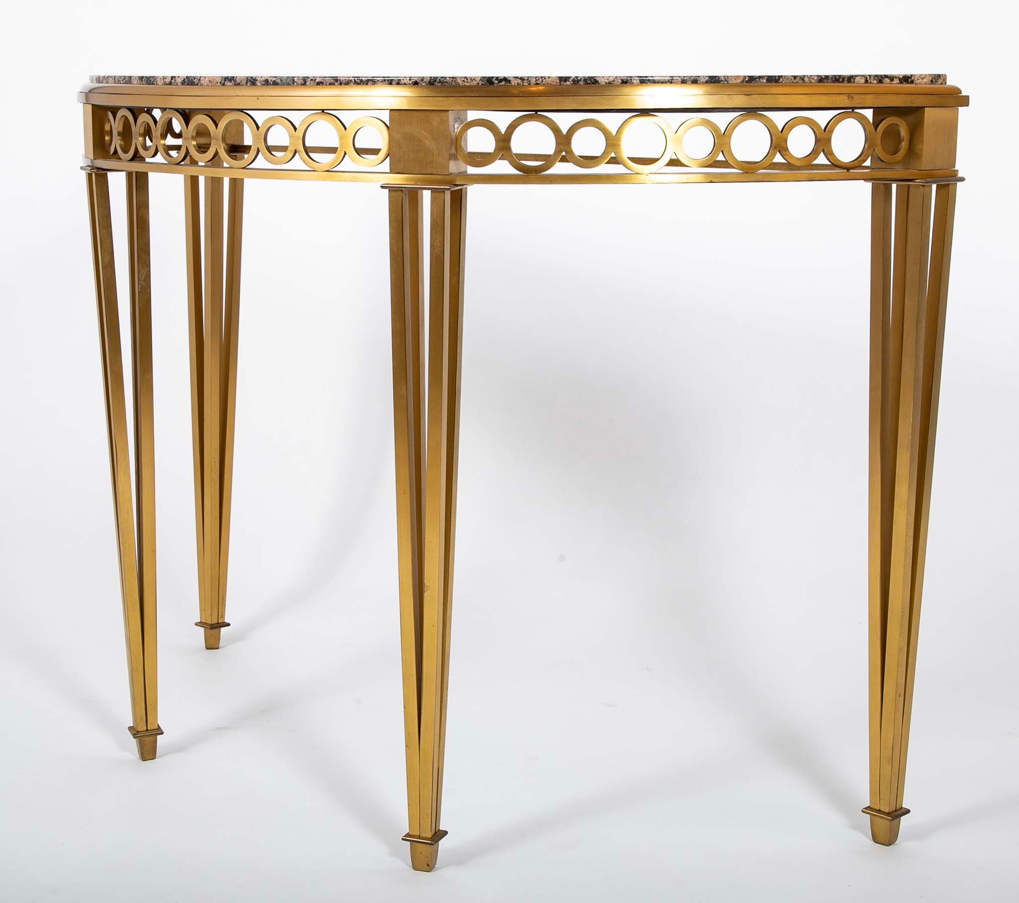 Striking Pair of Bronze Consoles with Fossilized Marble Tops