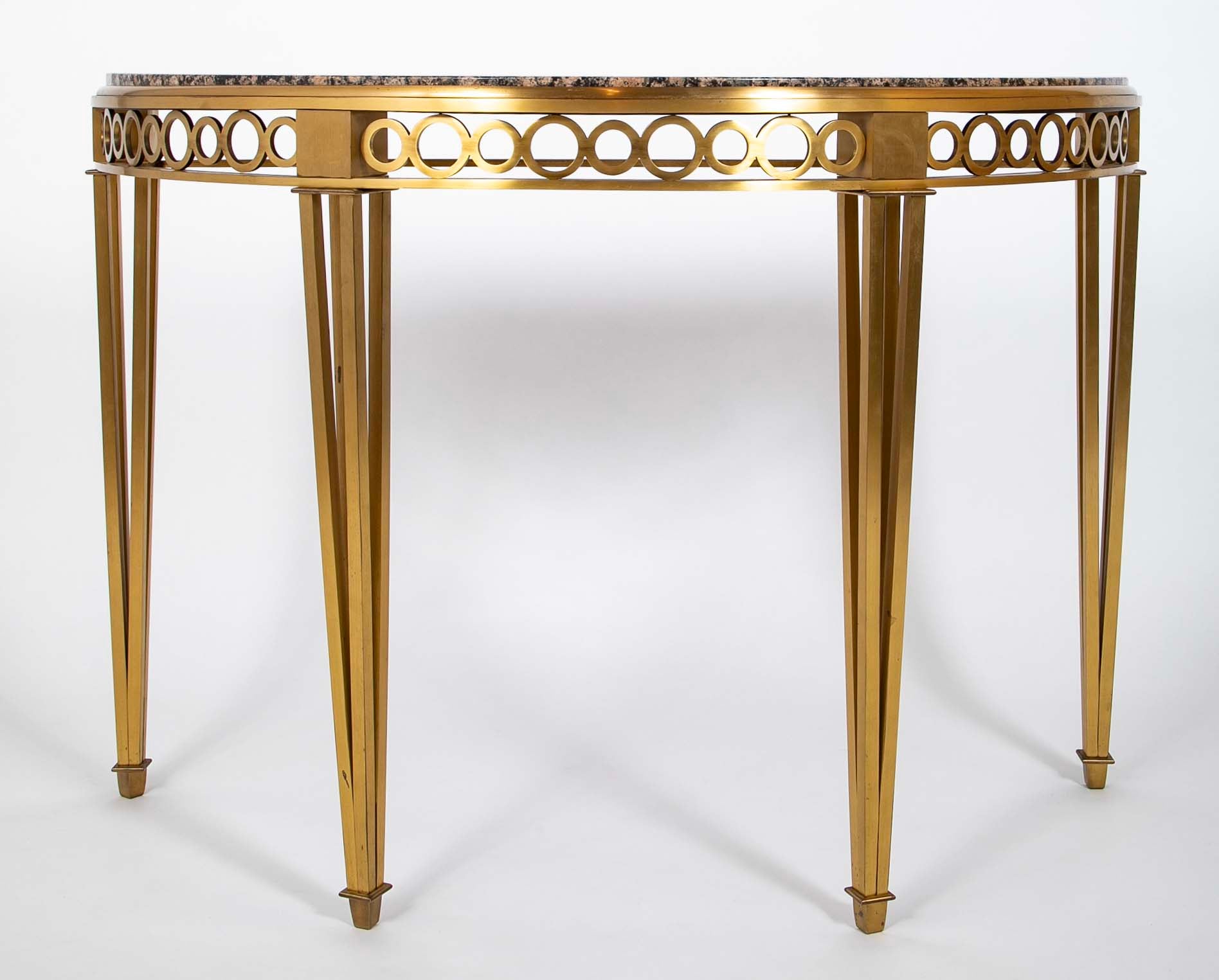 Striking Pair of Bronze Consoles with Fossilized Marble Tops