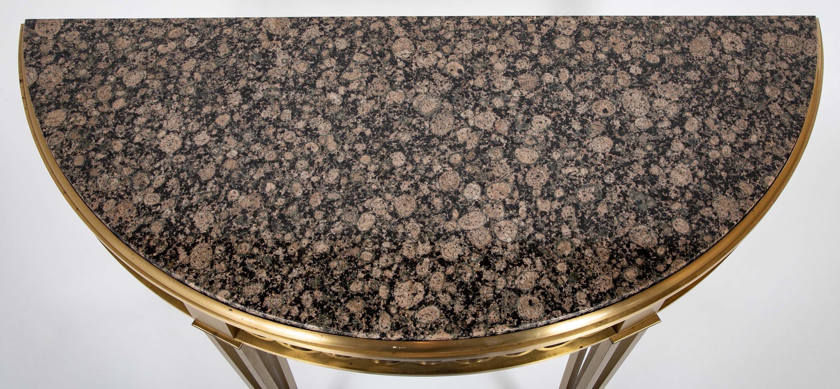 Striking Pair of Bronze Consoles with Fossilized Marble Tops